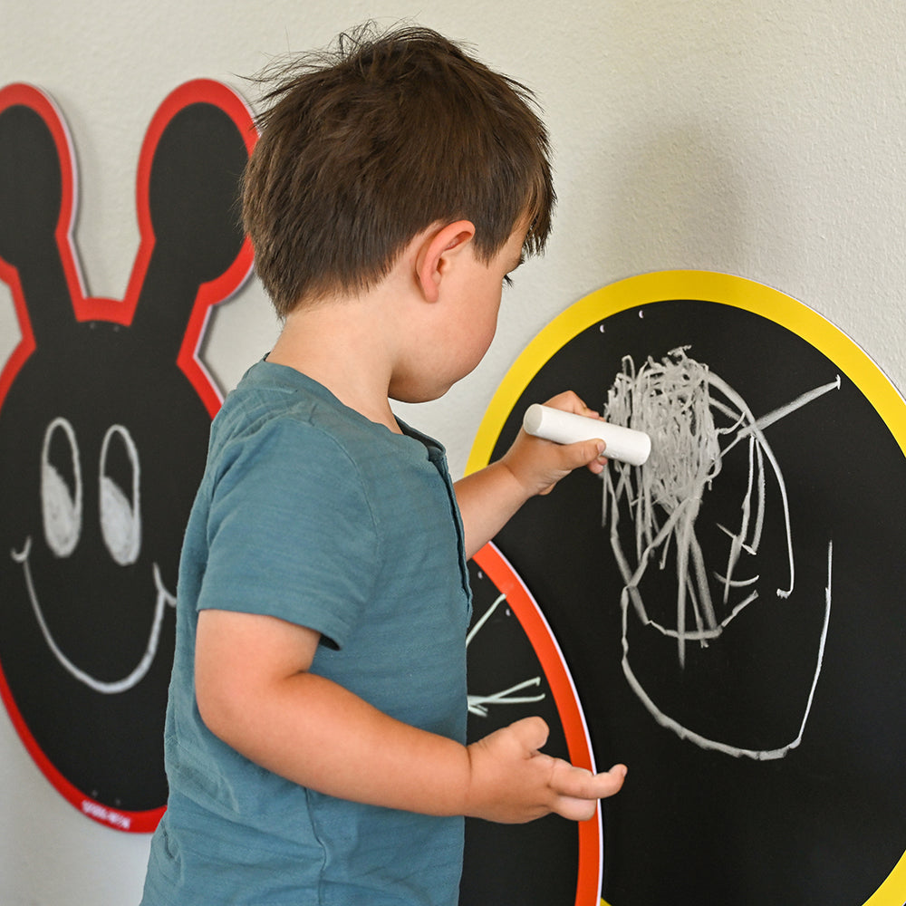 Close-up of Kid Drawing on Multiple-Panel Outdoor Chalkboard