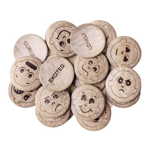Set of wooden buttons with facial expressions and text on a white background