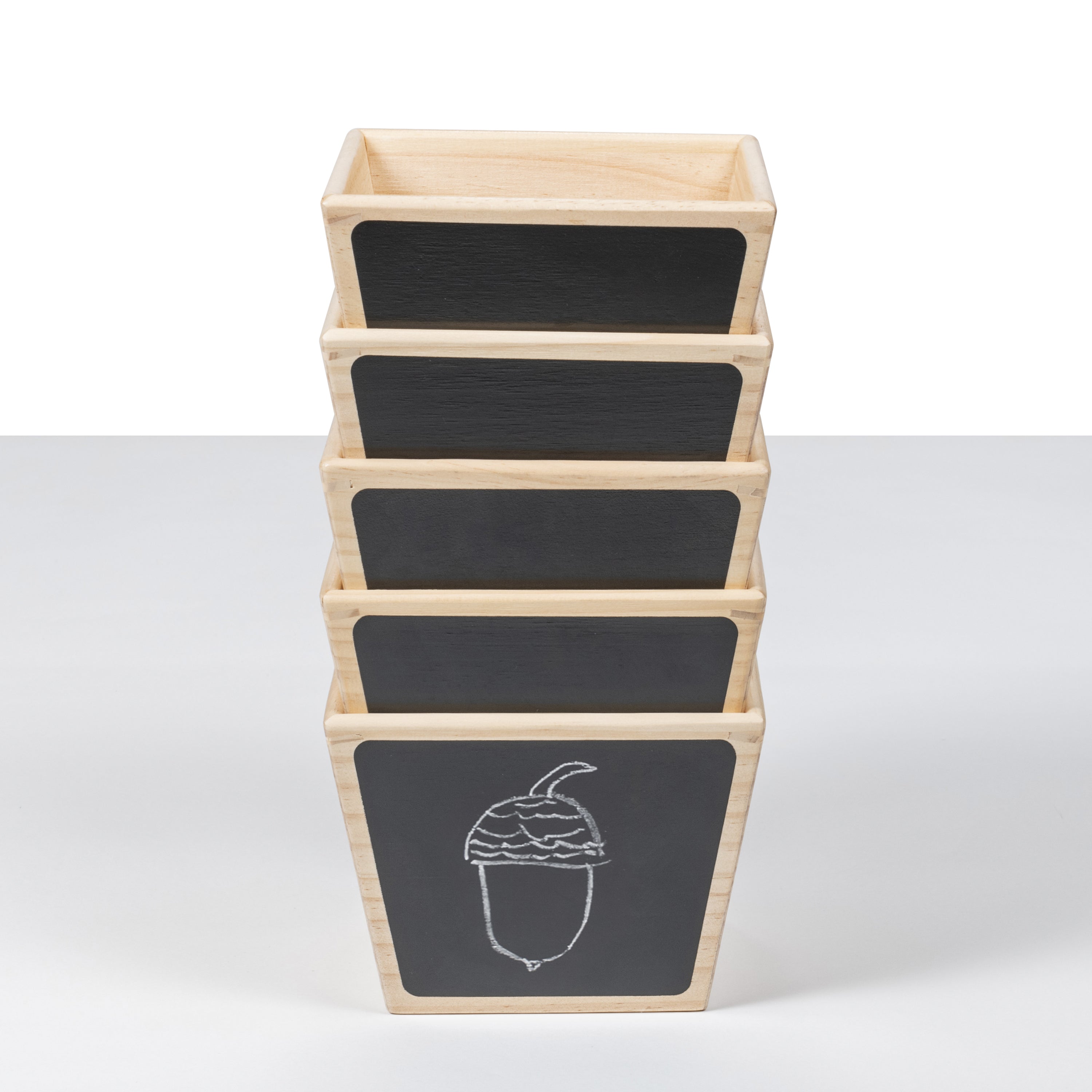 Stack of wooden crates with chalkboard labels on a white background