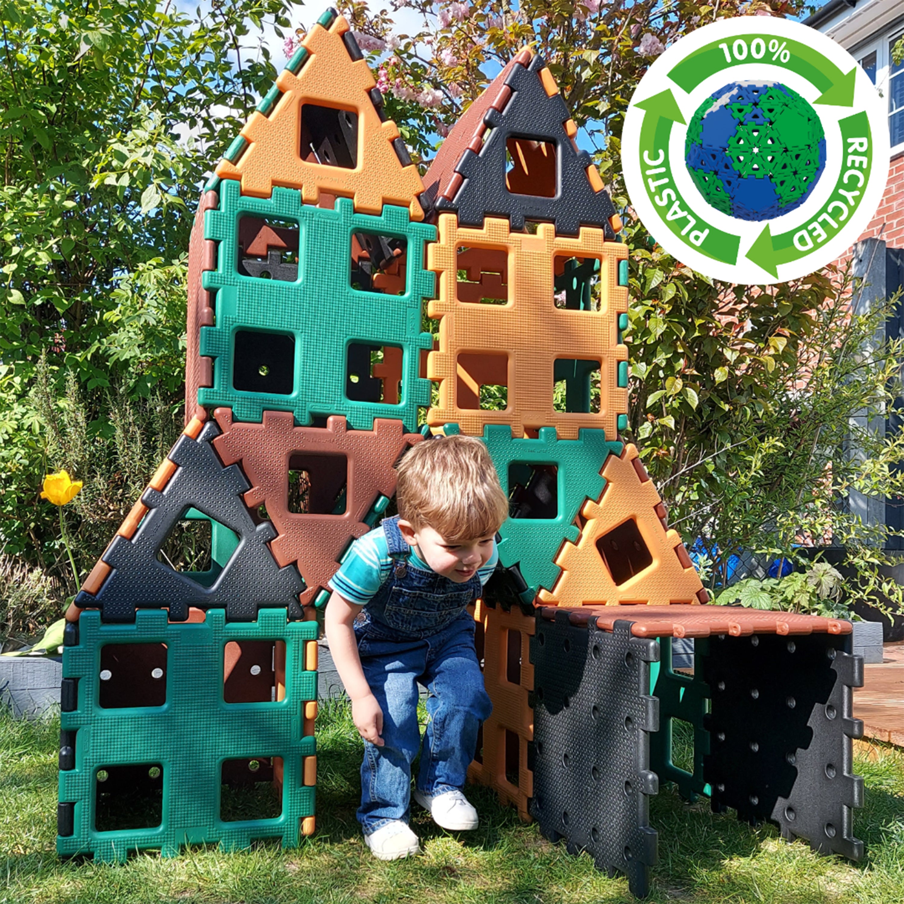 Child playing with a colorful play structure in an outdoor setting, with a recycling logo in the corner.