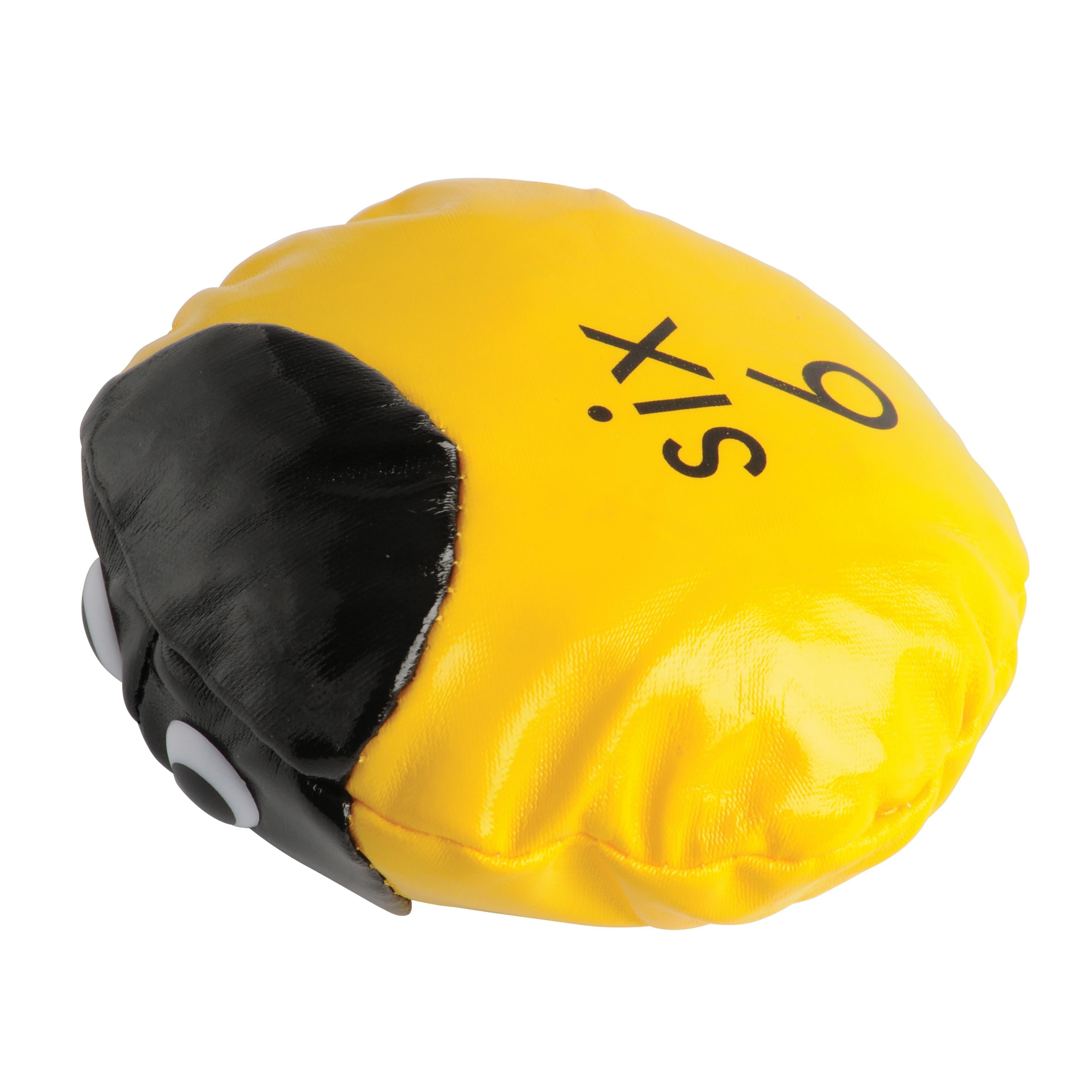 Yellow and black beanbag with 'six' written on it against a white background