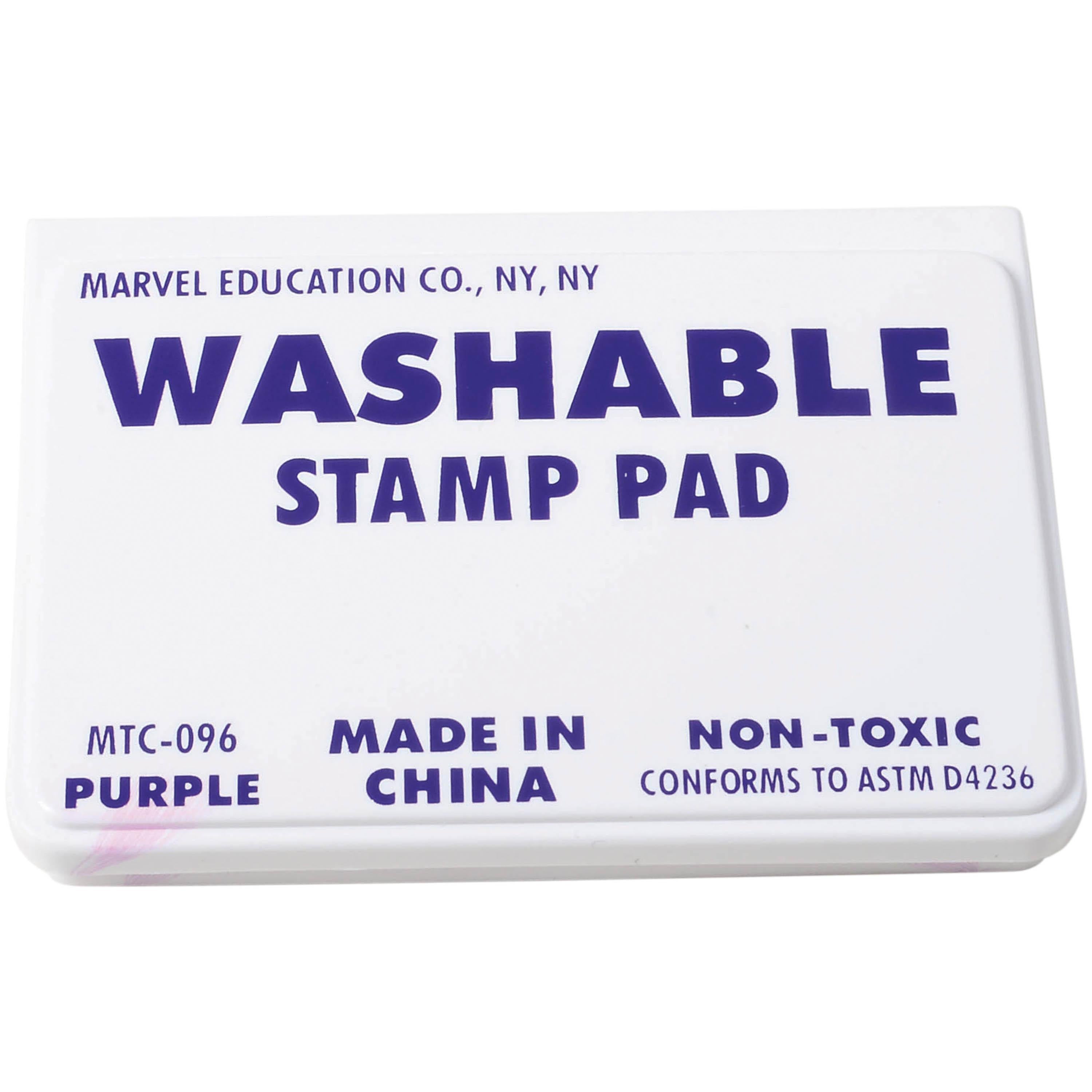 A rectangular white plastic case labeled 'WASHABLE STAMP PAD' with purple text, including 'MARVEL EDUCATION CO., NY, NY' and 'MTC-096 PURPLE'.