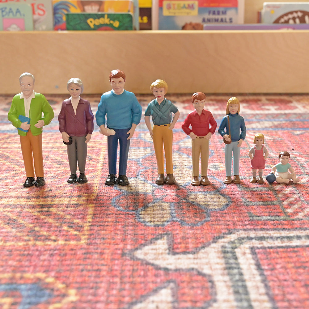 Family Figurines Lined Up In Descending Order