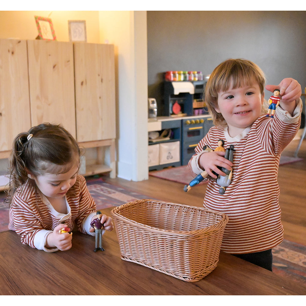 Two Toddlers Playing with Asian Pretend Play Vinyl Family Figurines