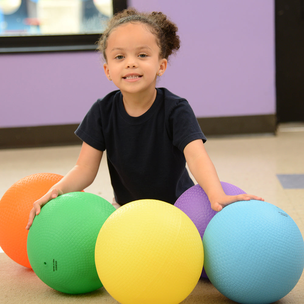 Surrounded by Five Large Playground Balls