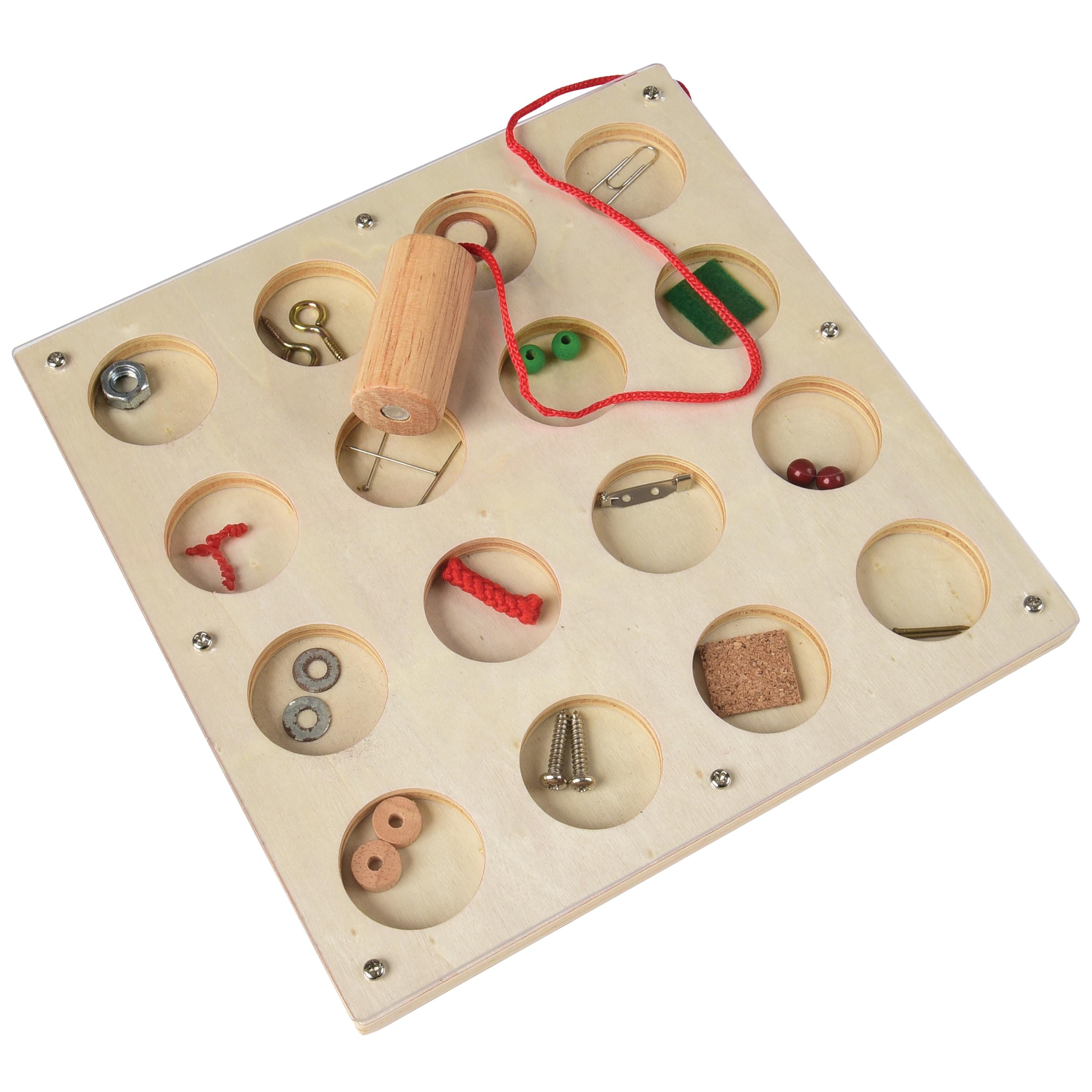 Wooden puzzle with various objects in circular holes on a white background