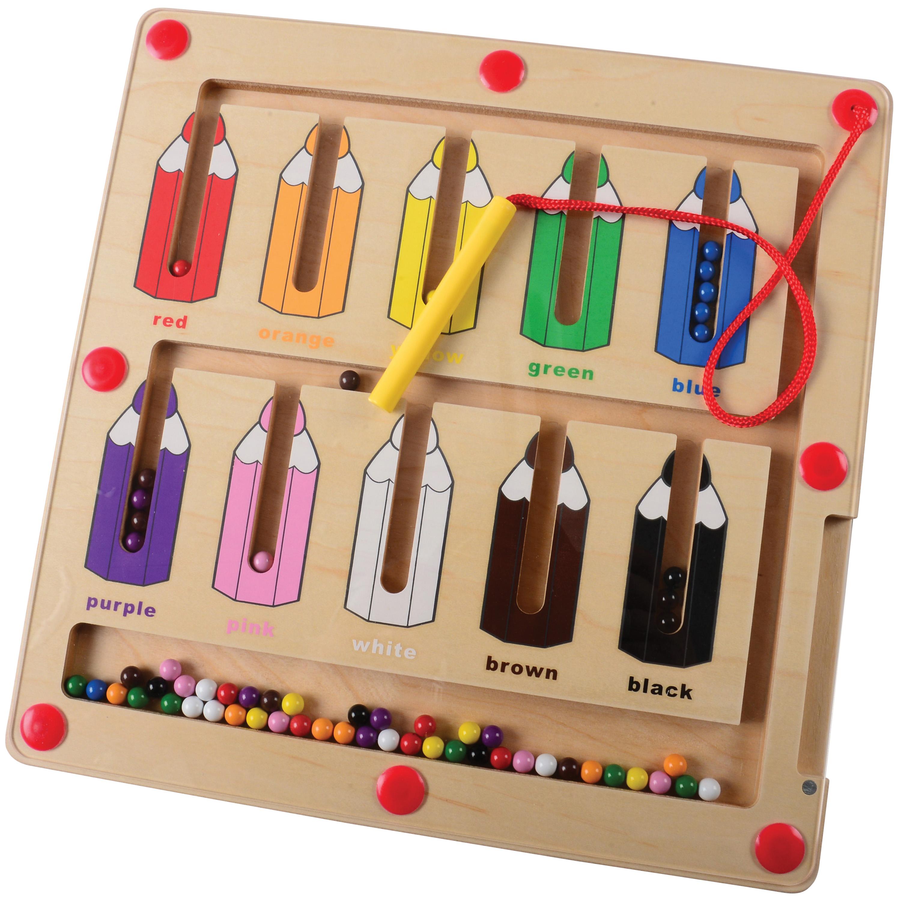 Wooden educational puzzle with colored pencils and magnetic balls on a white background