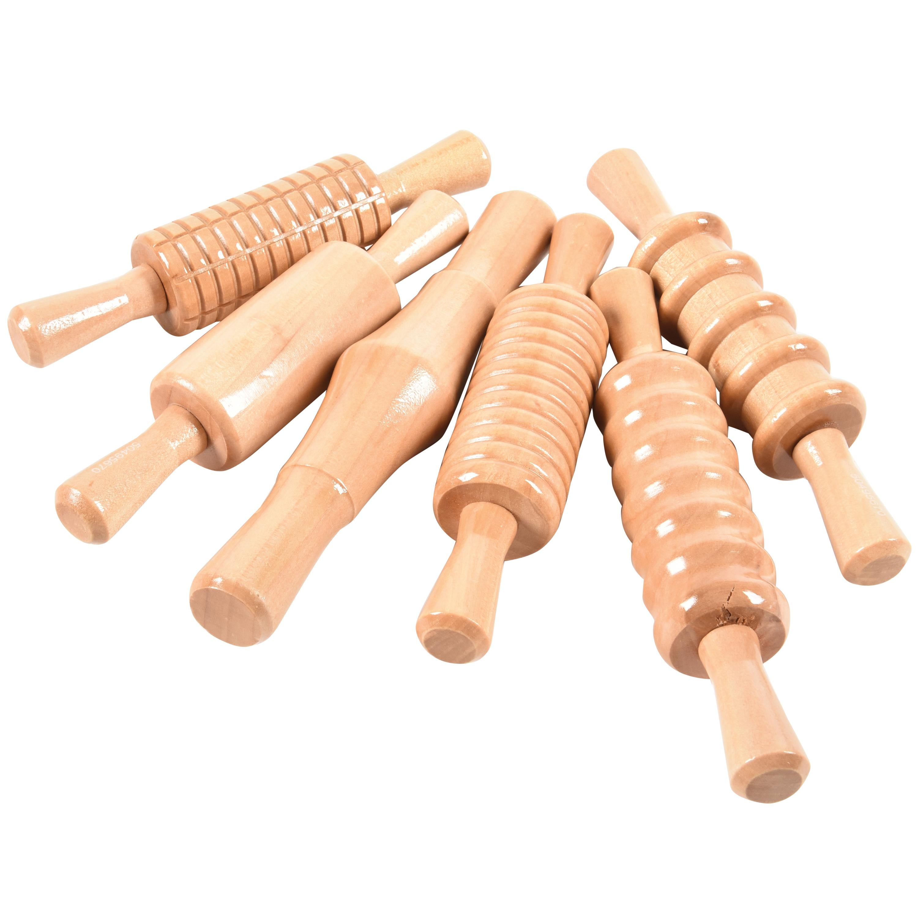 Set of wooden rolling pins on a white background