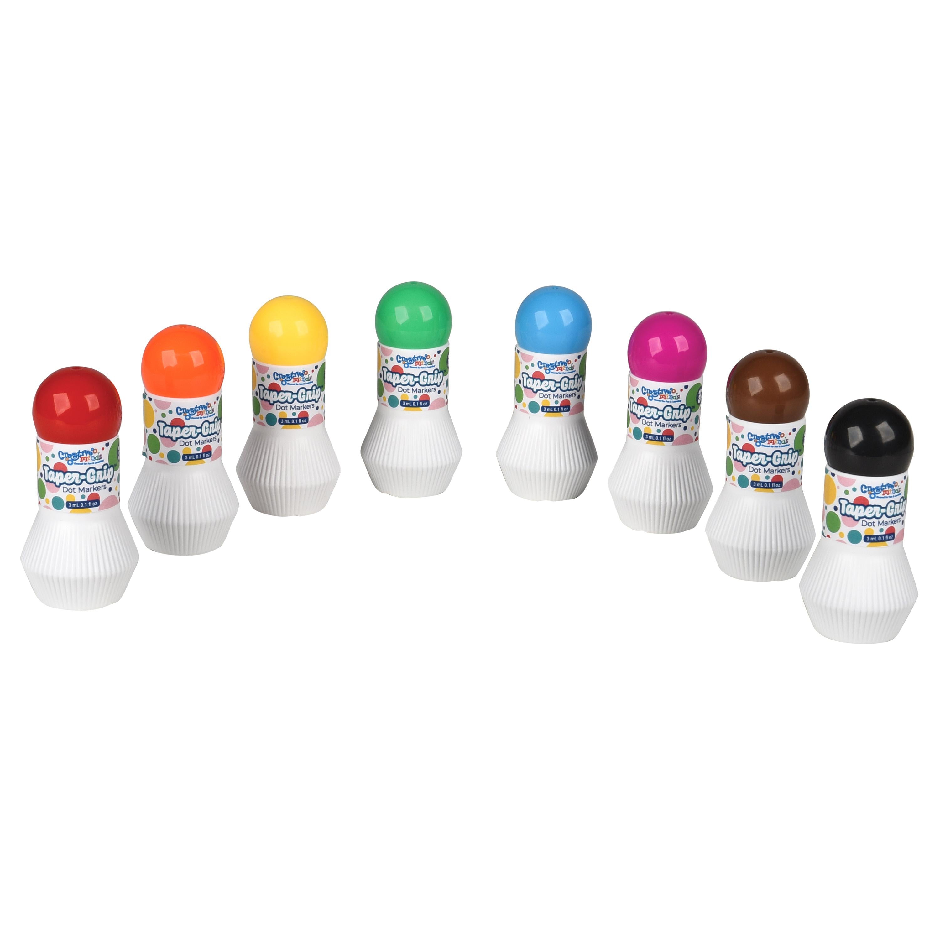A set of ten small paint-by-numbers style art kits arranged in a row on a plain white background. Each kit has a white ribbed base, a colorful label, and a round cap in a different color: red, orange, yellow, green, blue, pink, brown, and black.