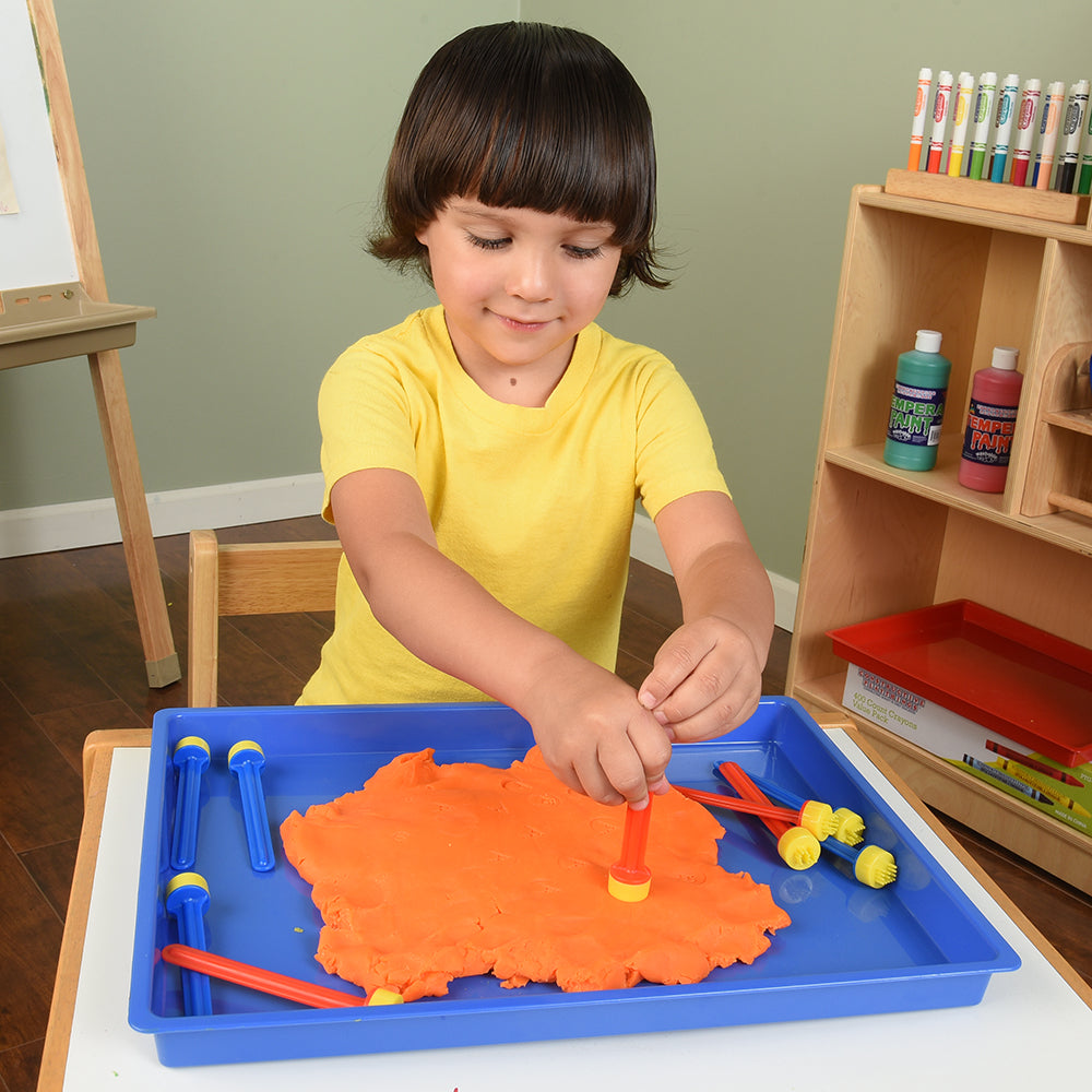 Kid Using Stampers in Orange Clay