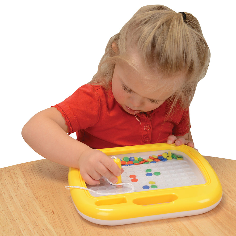 Child Interacting with Magnetic Mosaic