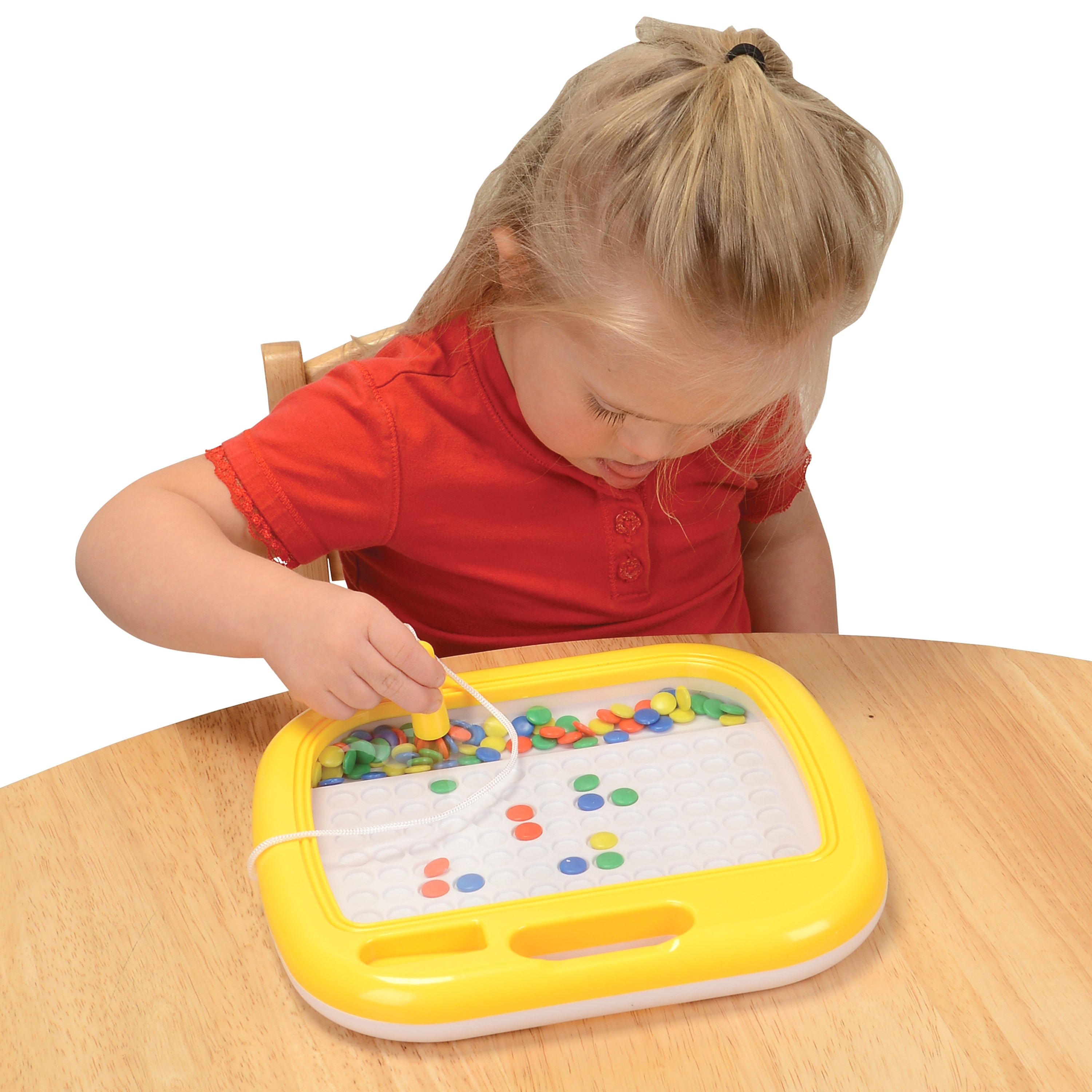 Child Playing with Magnetic Mosaic