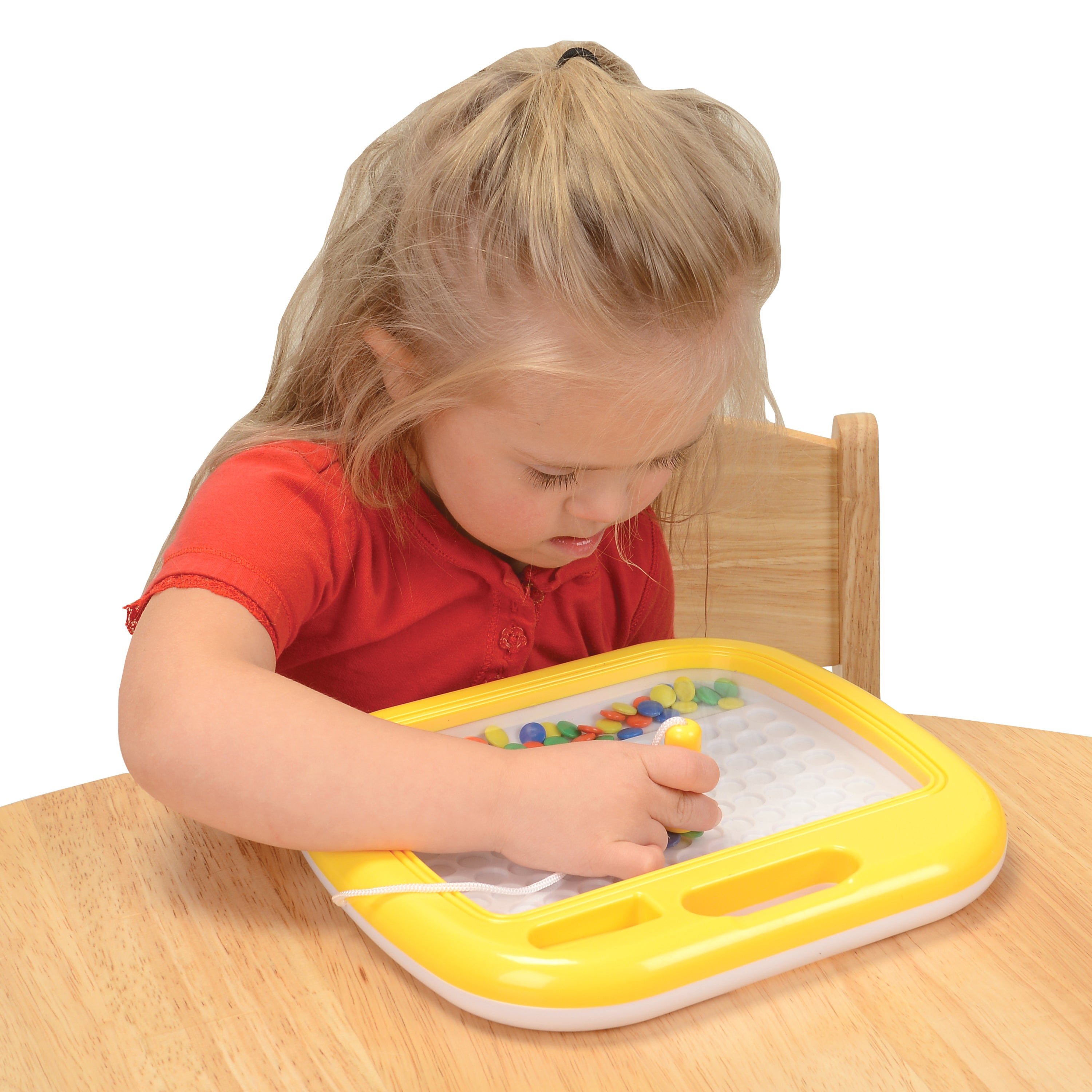 Child Playing with Magnetic Mosaic