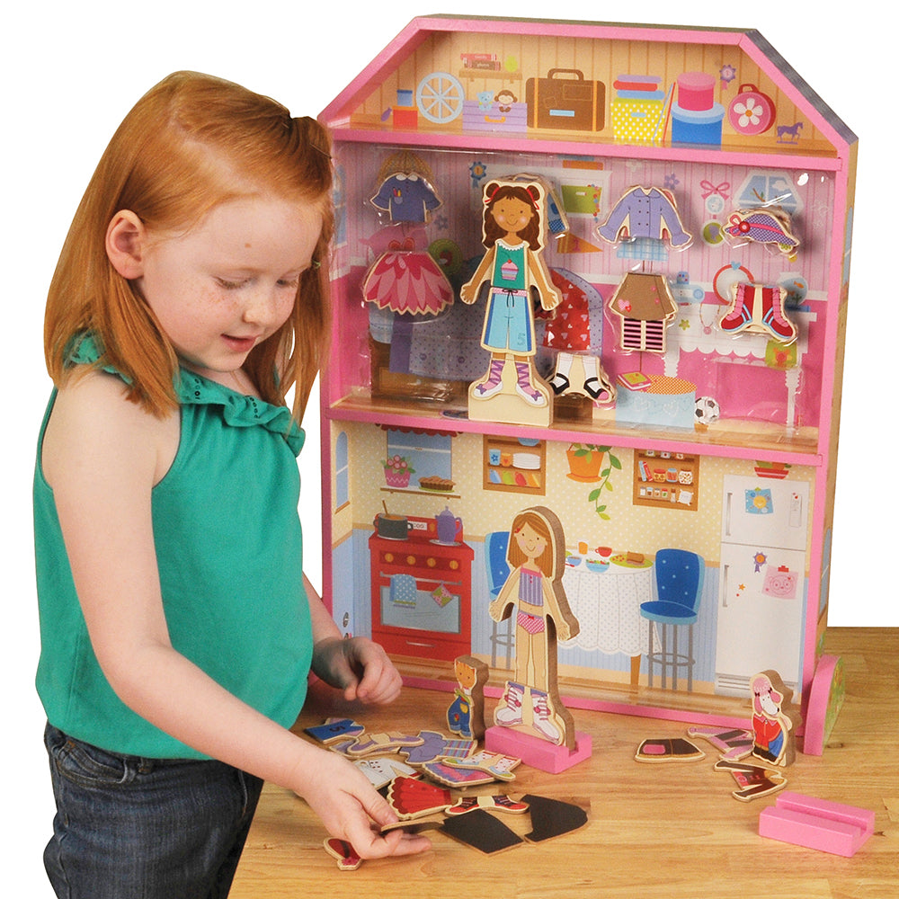 Child Playing With Wooden Magnetic Dollhouse with Dolls & Accessories