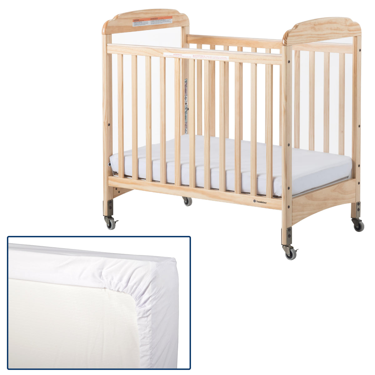 Natural wood baby crib with white mattress and fitted sheet, shown on a white background with a small inset close-up of the fitted sheet corner.