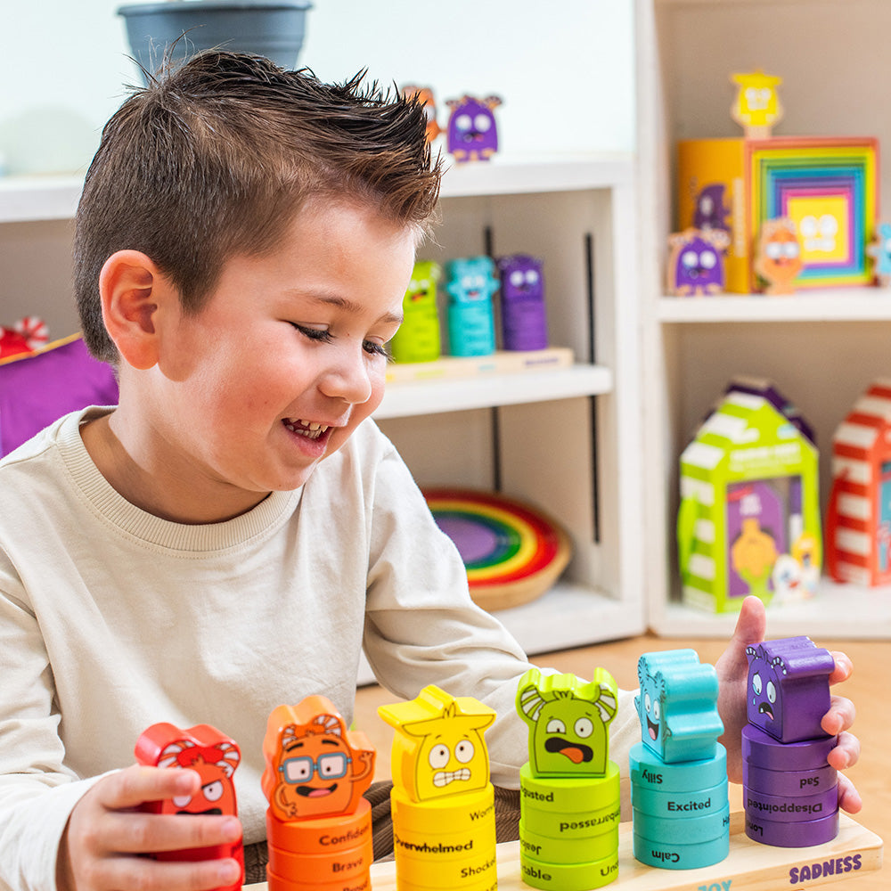 Child playing with colorful toy blocks in a playful indoor setting