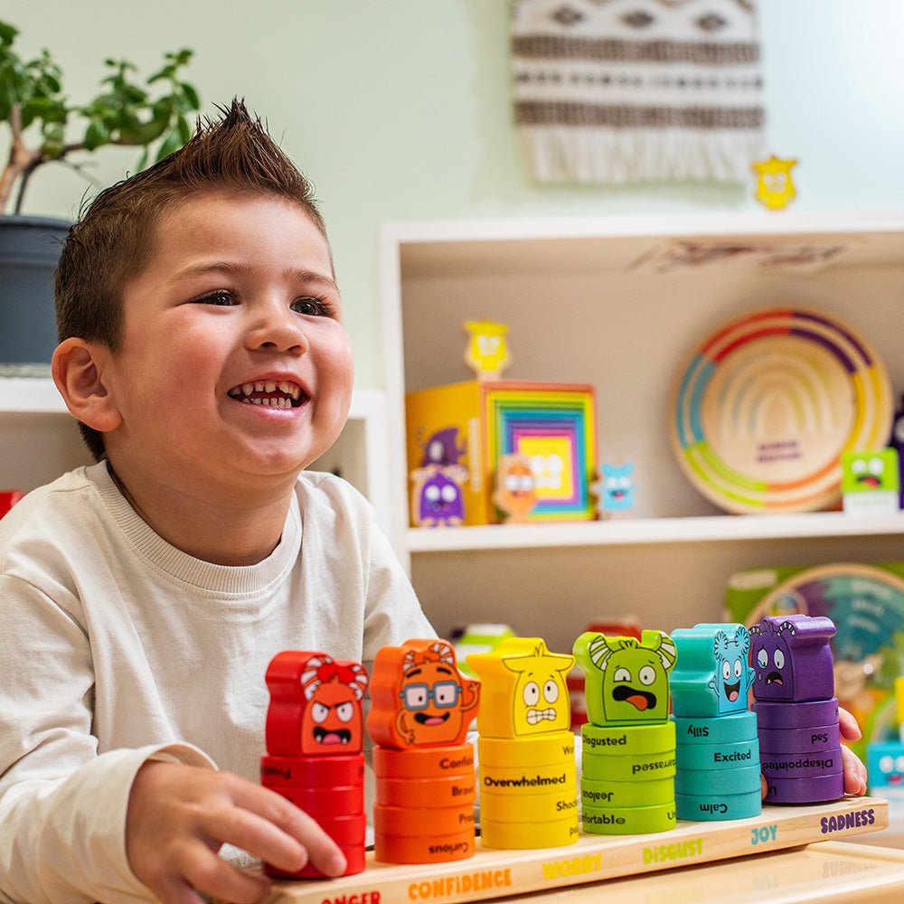 Child playing with colorful toy blocks in a playful indoor setting