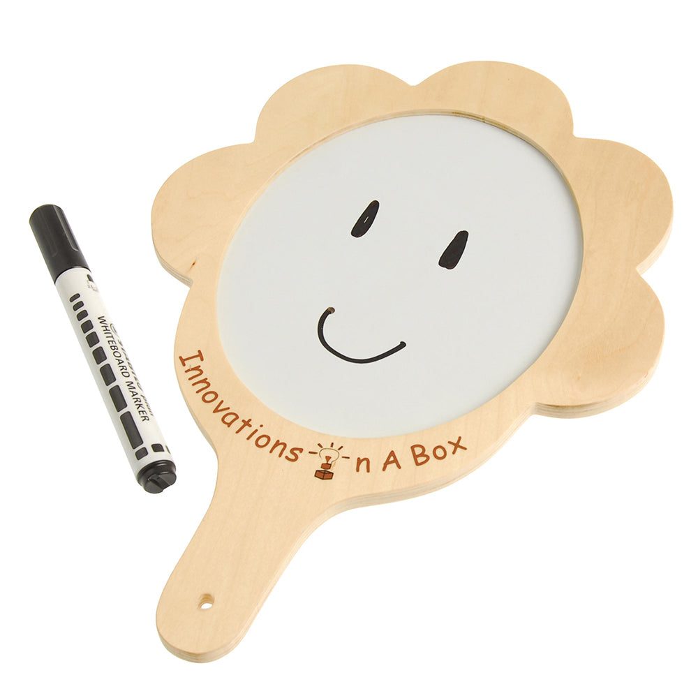 Wooden board with a smiley face and whiteboard marker, branded 'Innovations in a Box'.