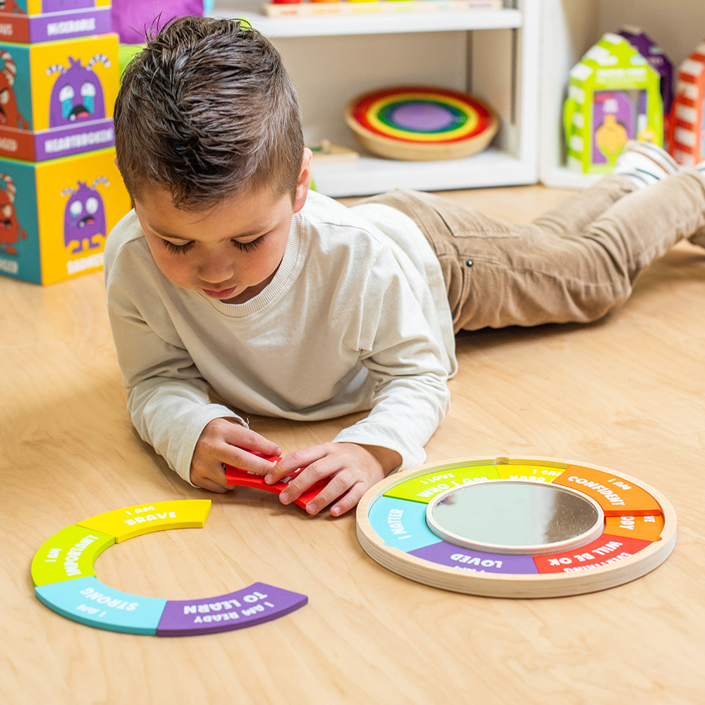 Child playing with educational toys on a wooden floor