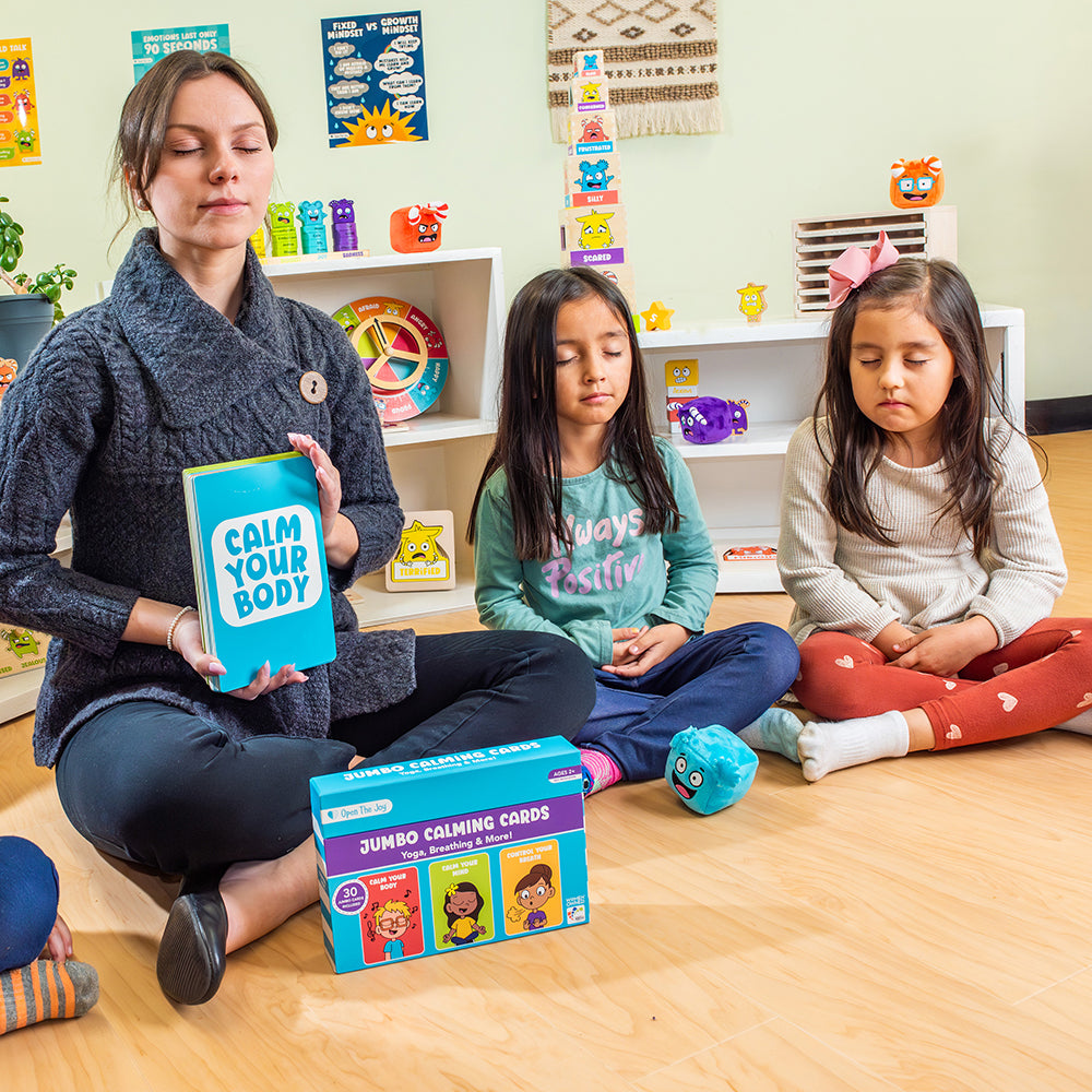 Teacher and students in a classroom setting with mindfulness materials