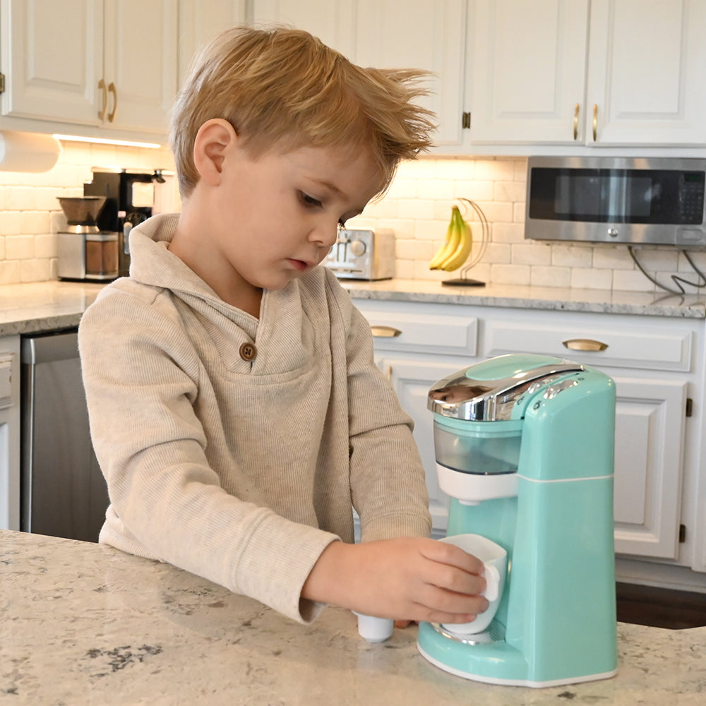 Kid Having Fun with Realistic Coffee Maker