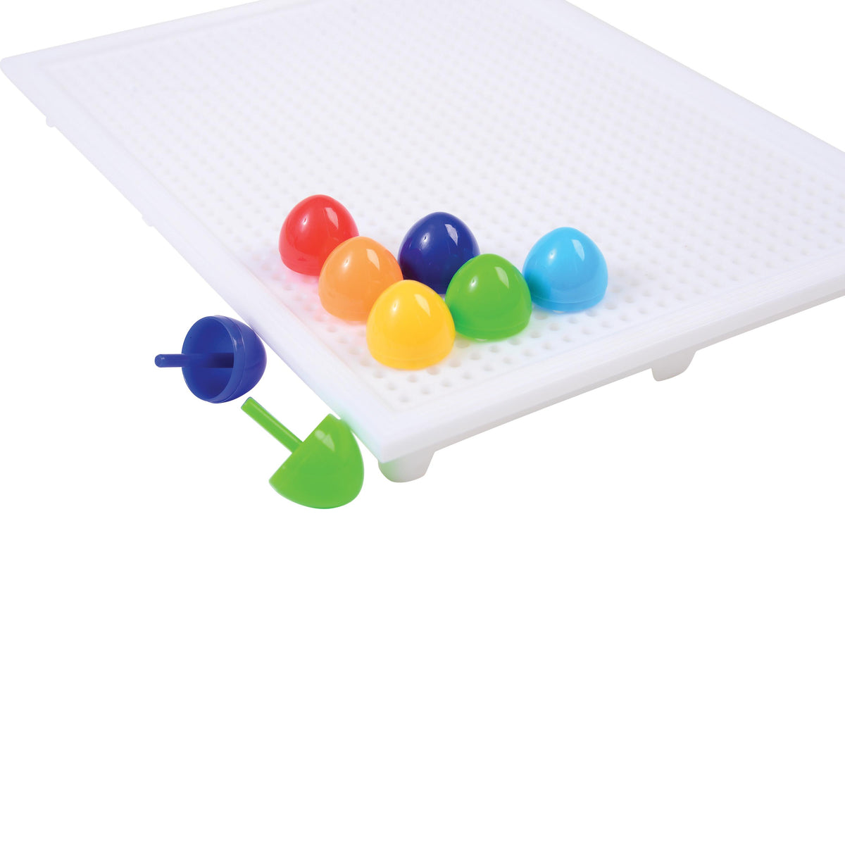 Colorful magnetic balls on a white tray with a white background