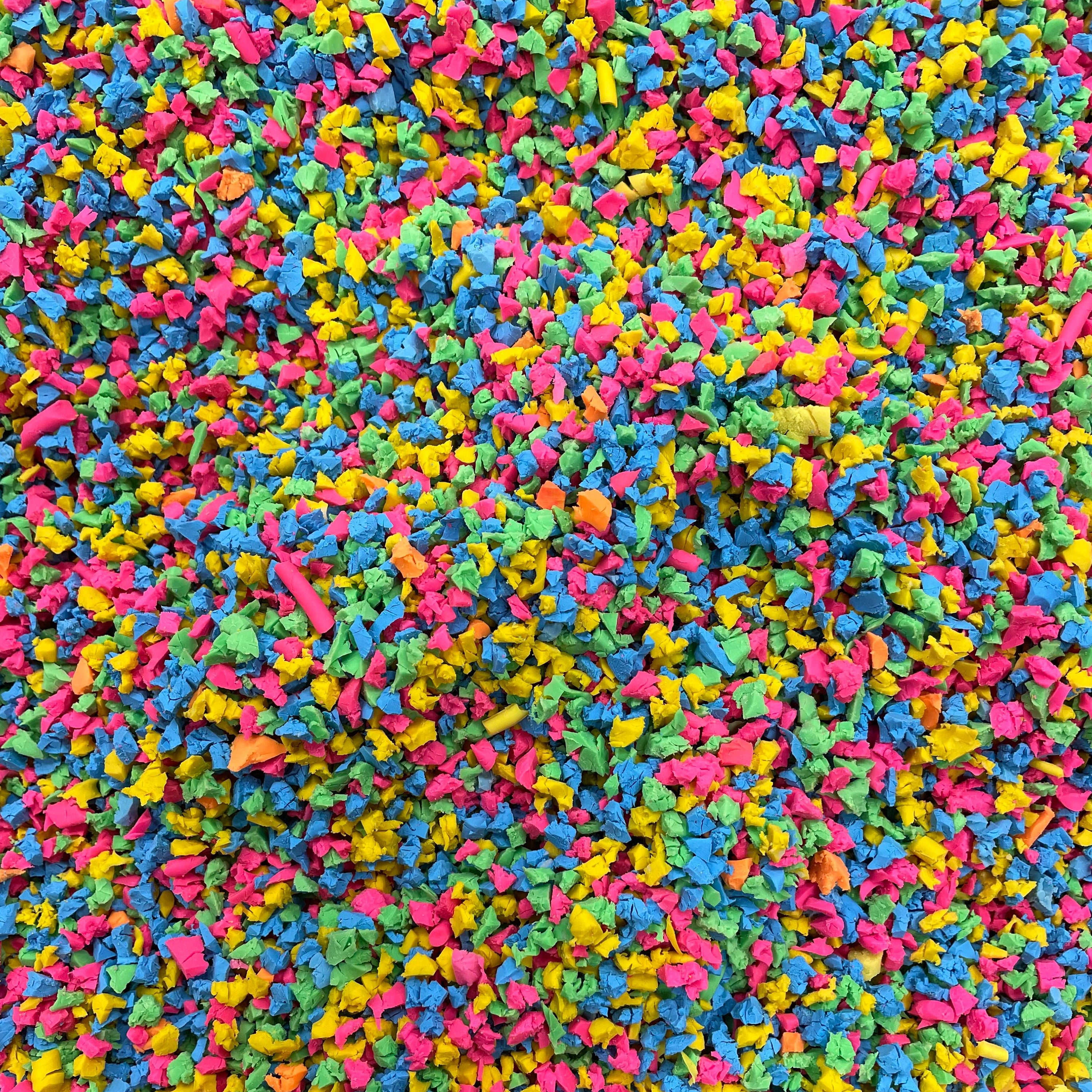 Multicolored crumb-like texture with pink, blue, green, and yellow colors.