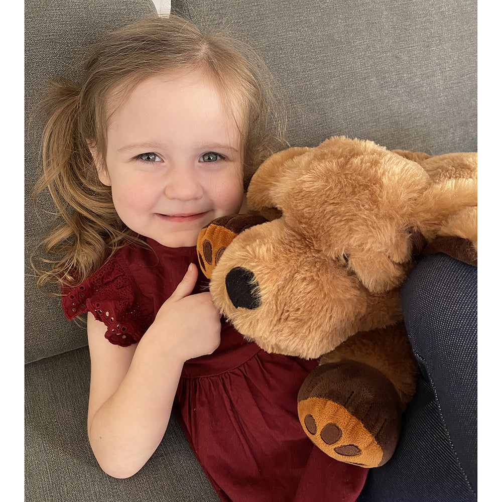 Child with Stuffed & Weighted Therapy Dog Toy