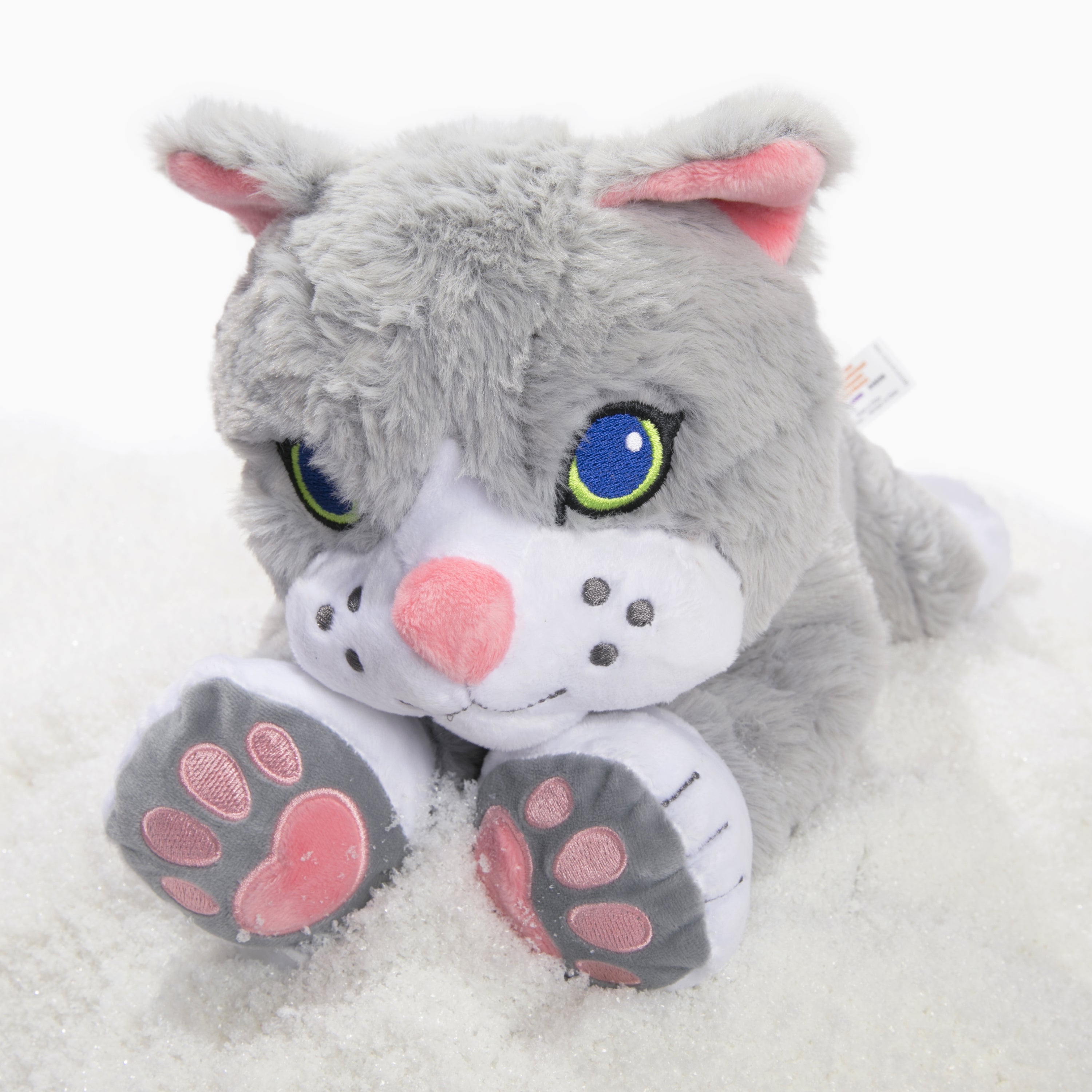 Plush toy cat with gray fur, pink ears and paws on a white background