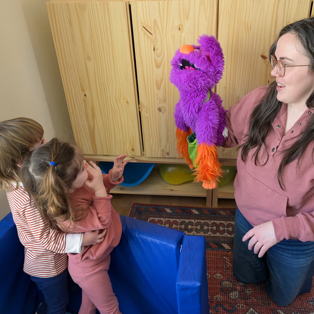 Toddlers Being Entertained with Edgar the Emotions Puppet