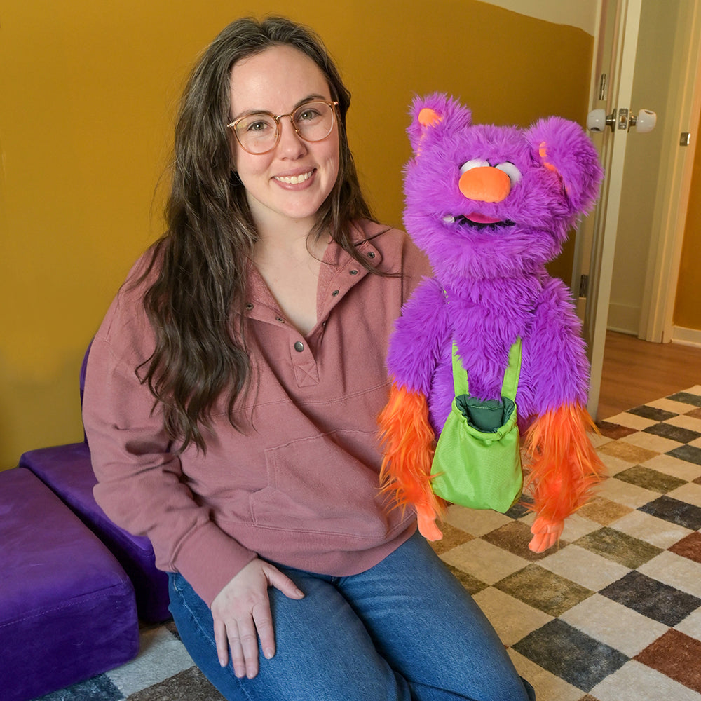 Adult Posing with Edgar the Emotions Puppet