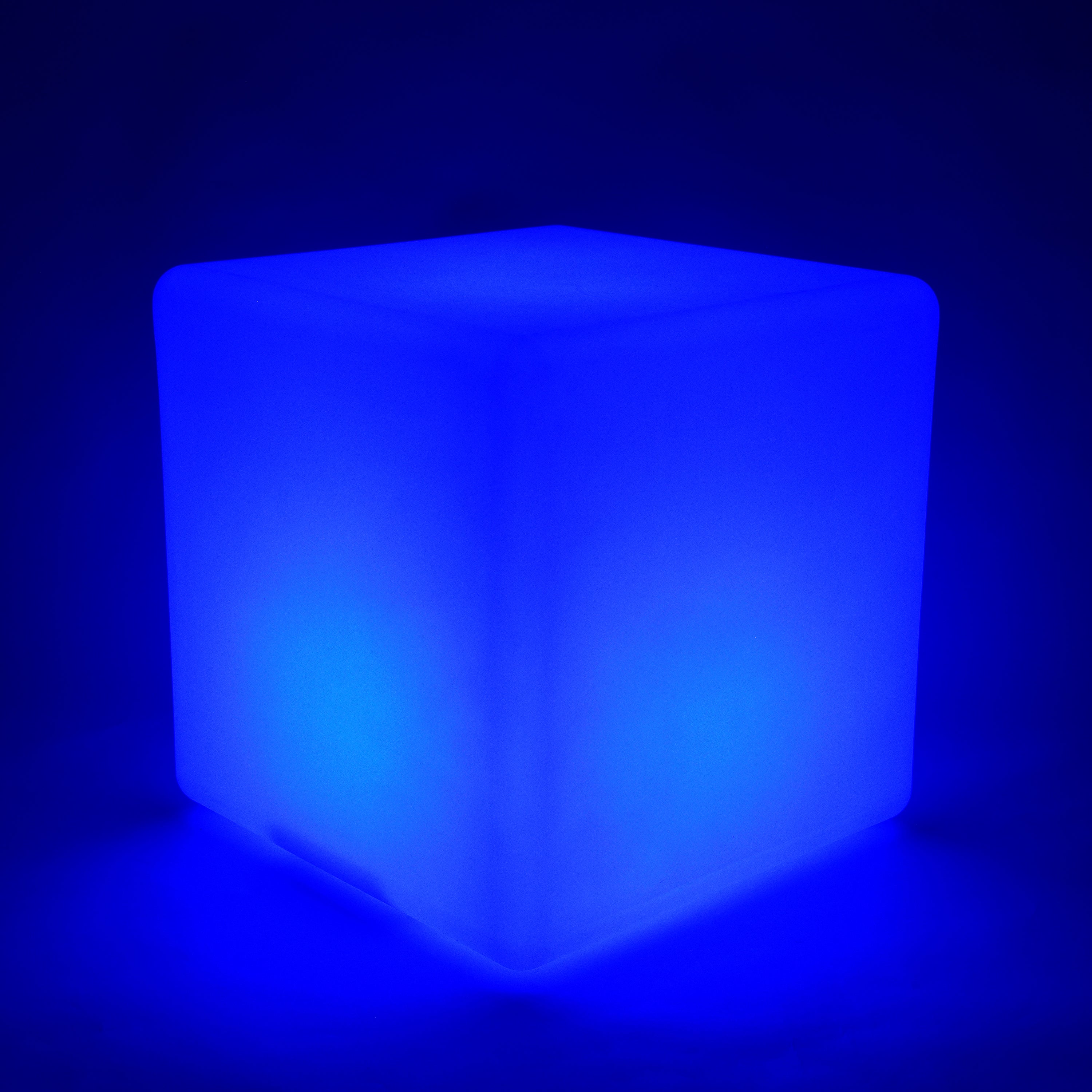 Blue illuminated cube on a dark background