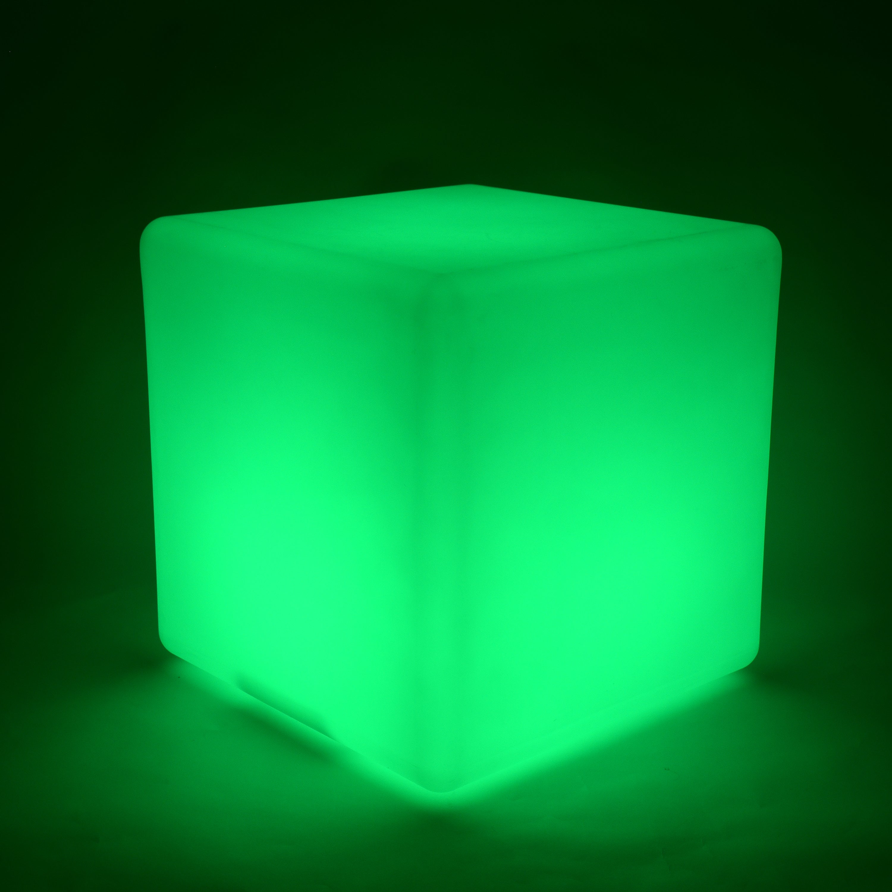 Green glowing cube on a black background