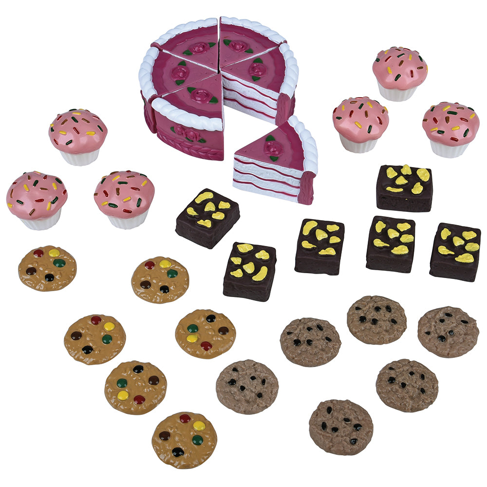 Set of toy cakes, cupcakes, and cookies on a white background