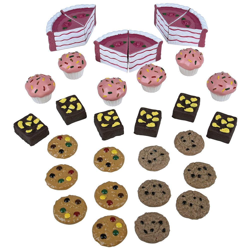 Assorted toy desserts including cakes, cupcakes, and cookies on a white background