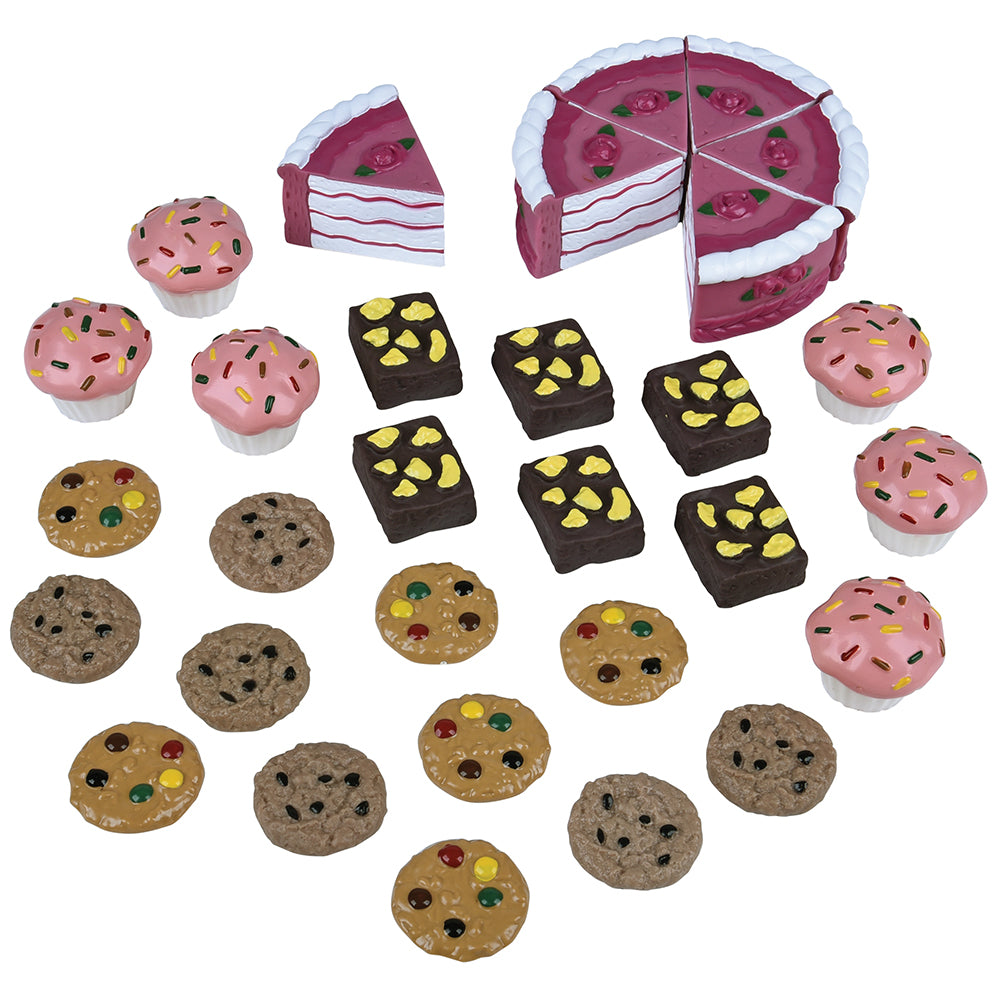Set of toy cakes and cookies on a white background
