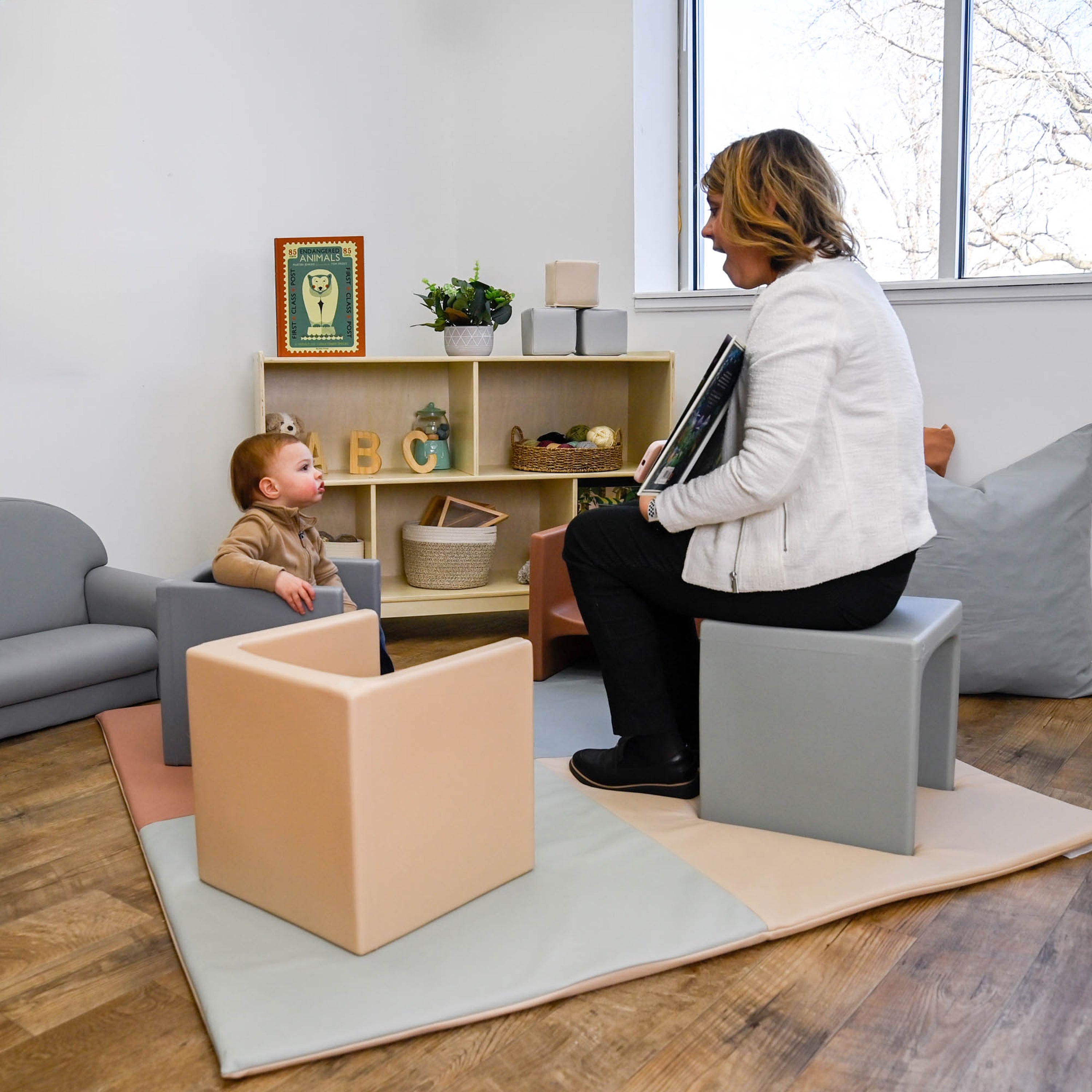 Woman and child in a room with colorful furniture and decor
