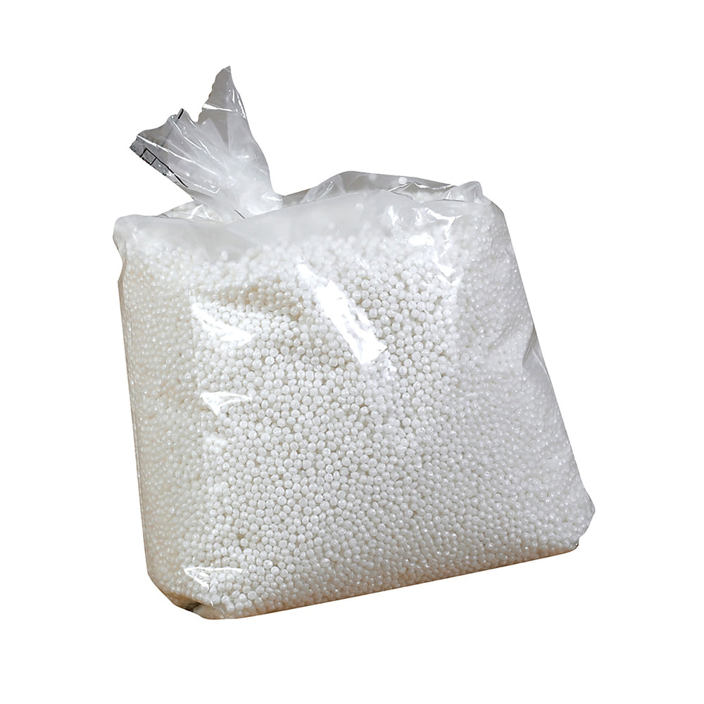 Clear plastic bag filled with white beads on a white background