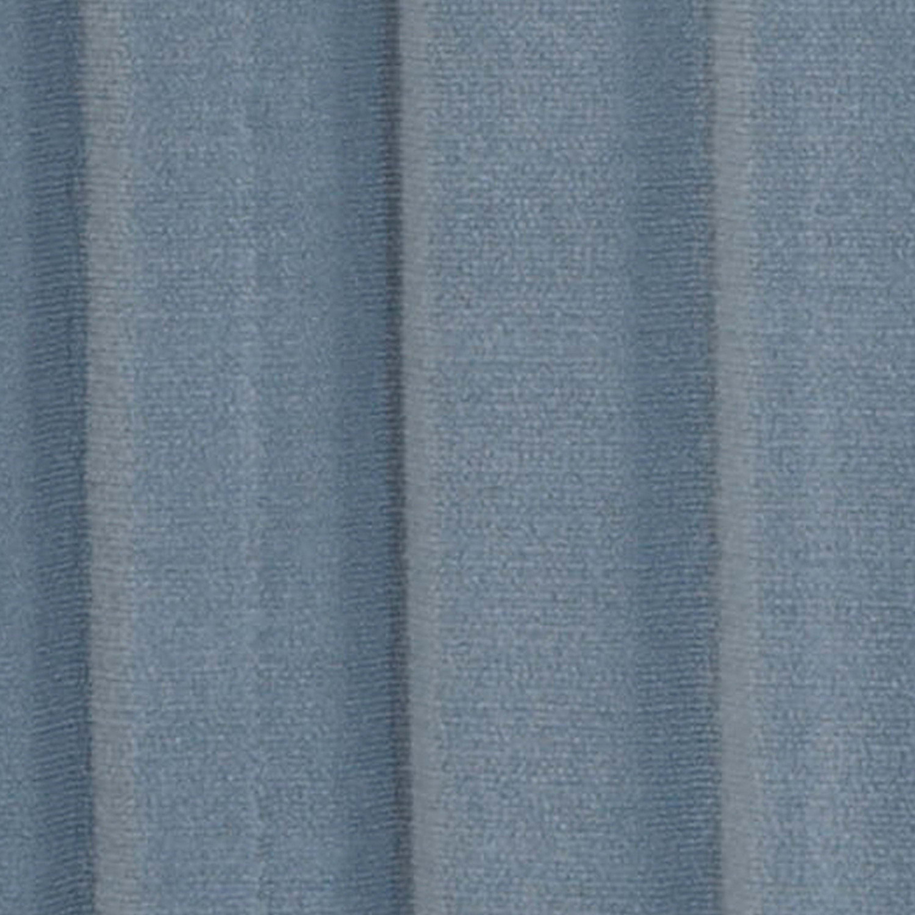 Close-up of textured blue fabric with vertical stripes