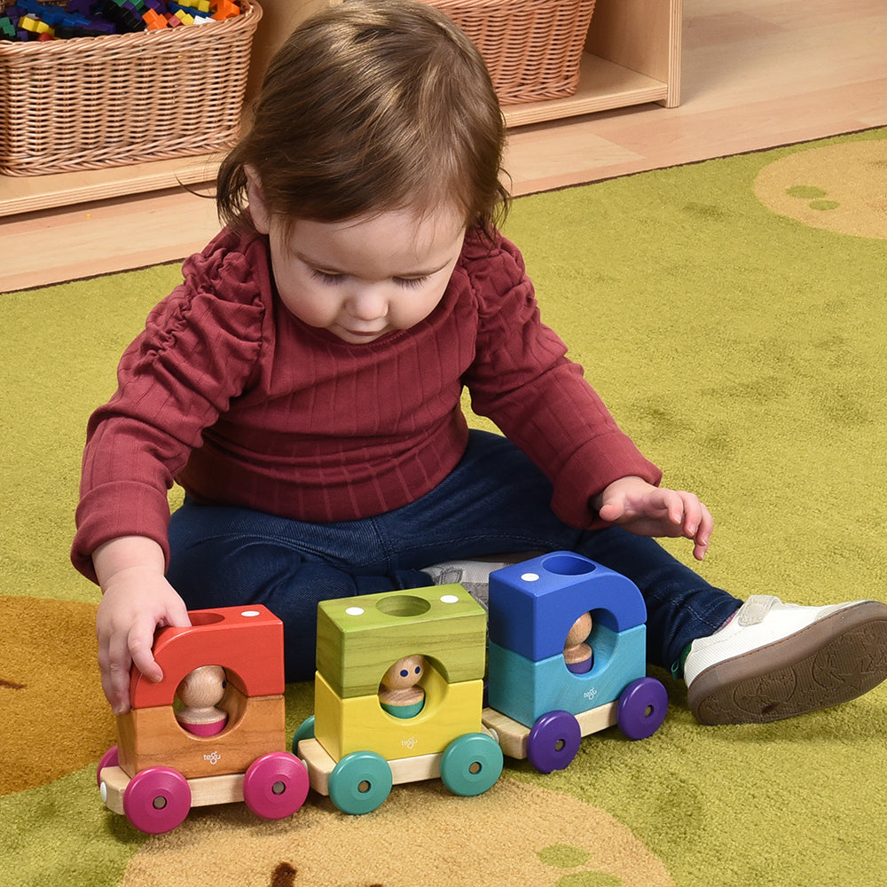 Toddler Playing with Tegu Magnetic Tram