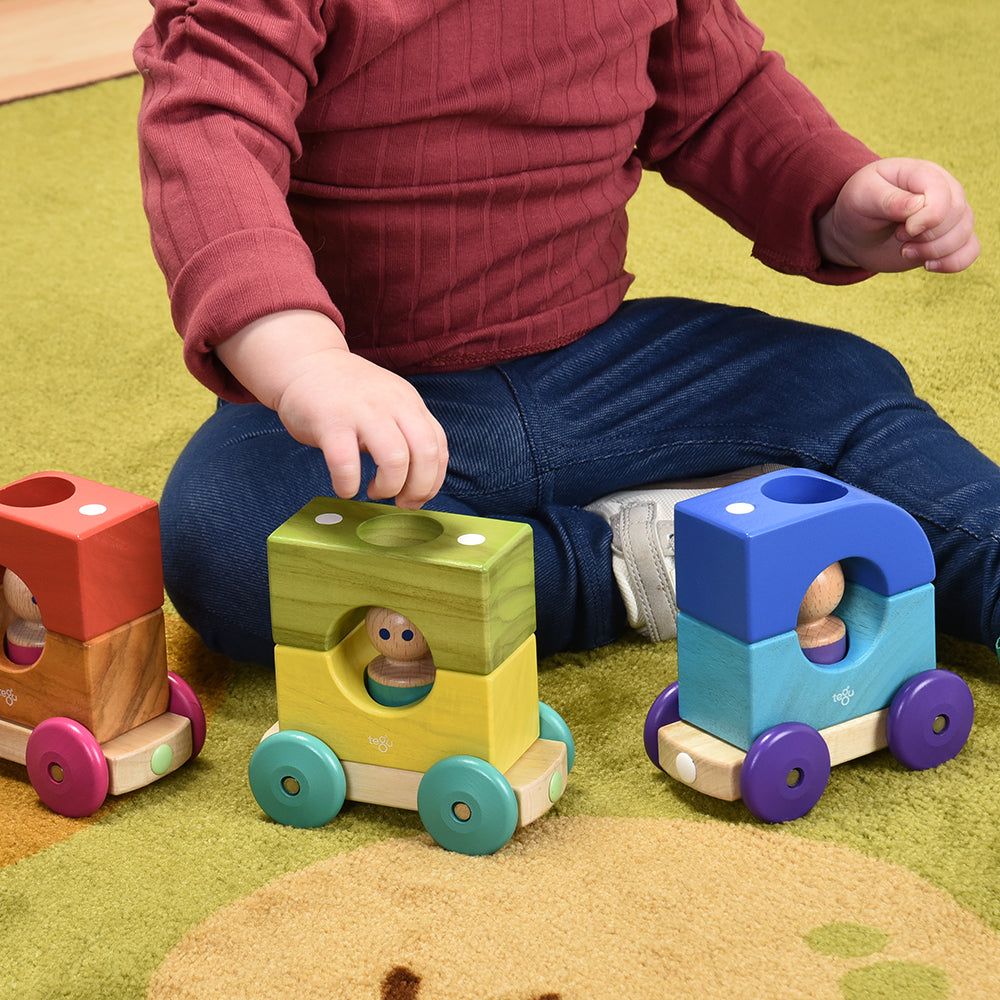 Close-up of Toddler Playing with Tegu Magnetic Tram