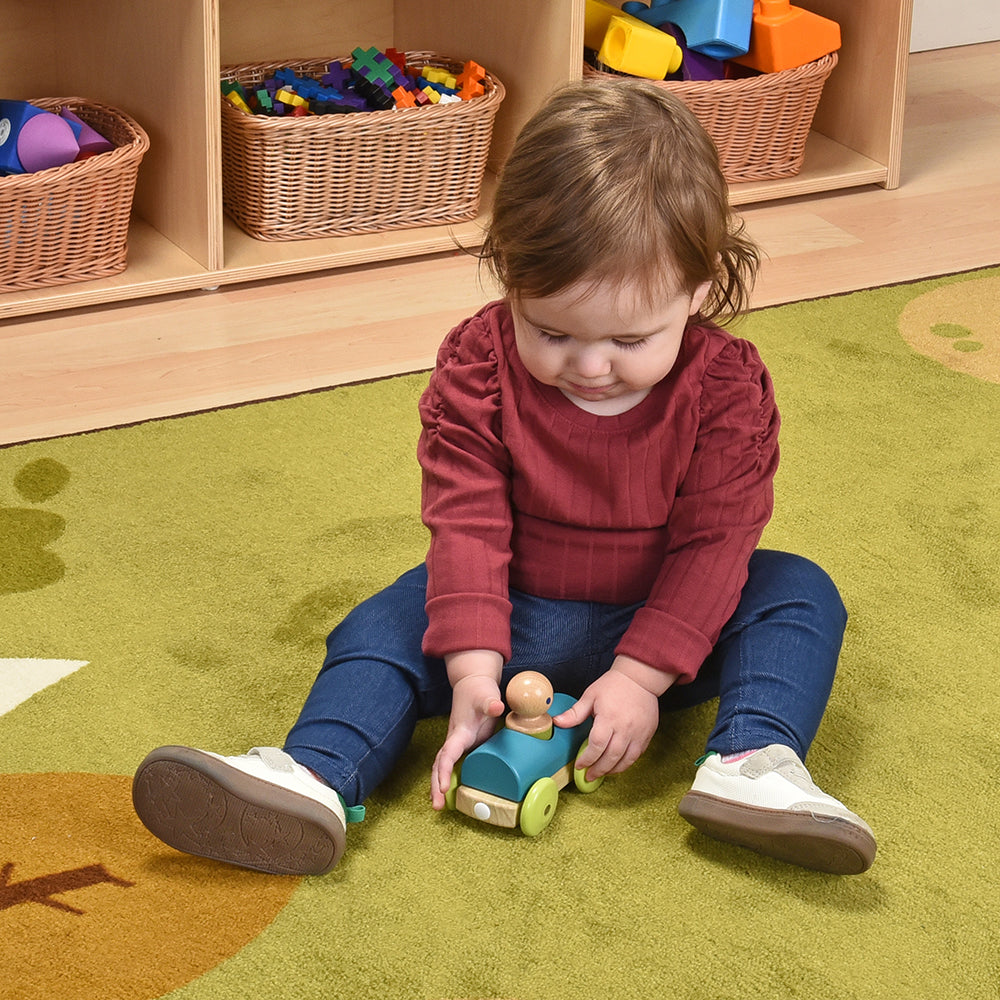 Toddler Interacting with Tegu Teal Magnetic Racer