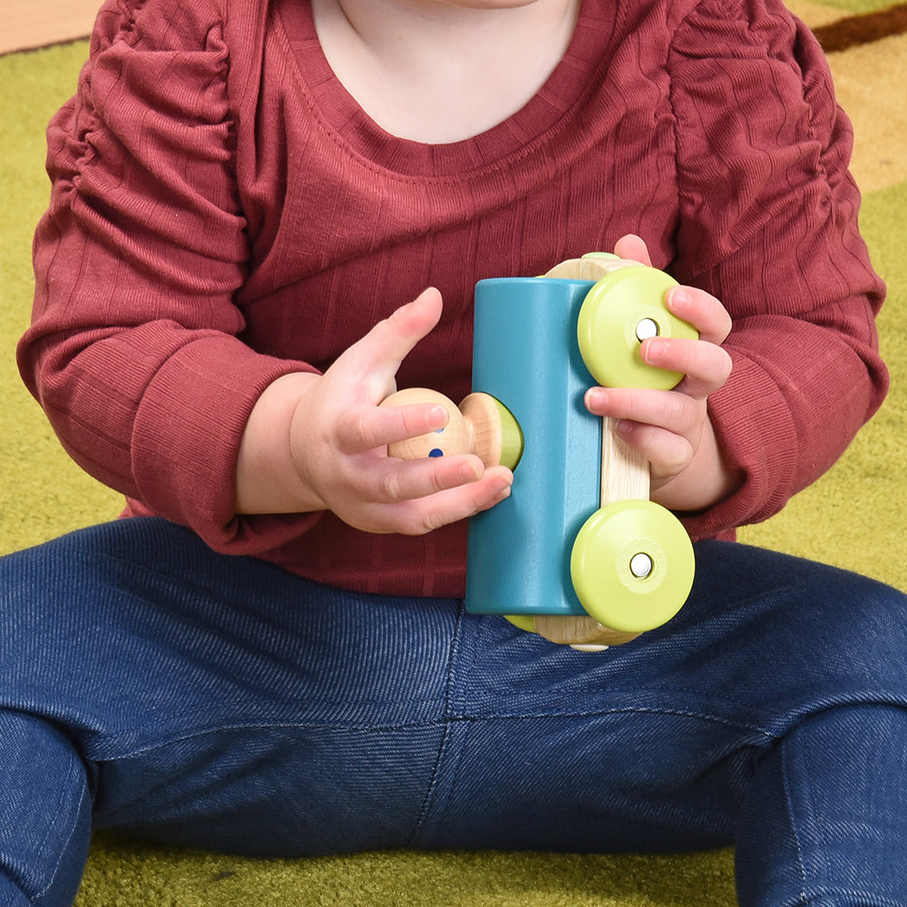 ToddlerPlaying with Tegu Teal Magnetic Racer