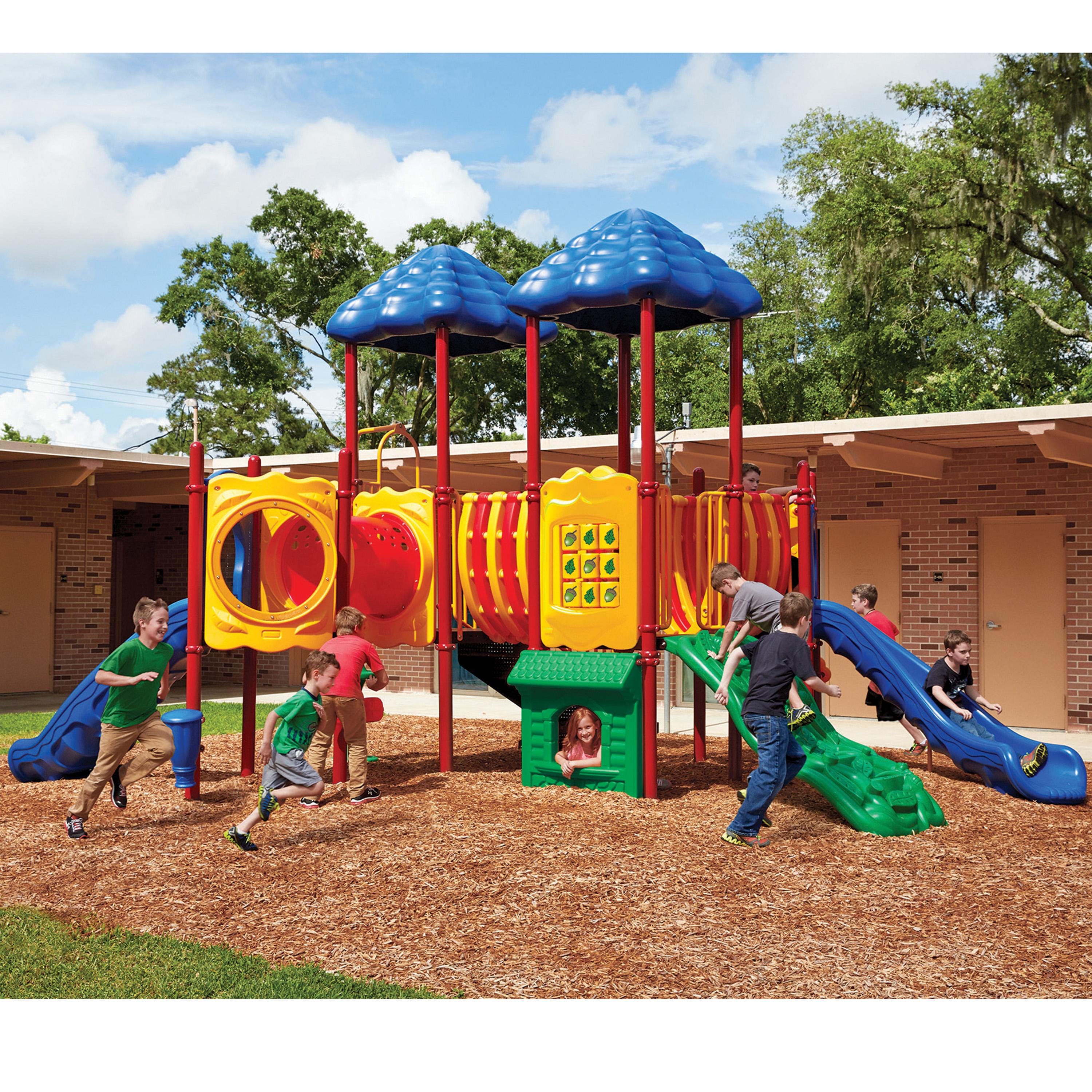 Children playing on a colorful playground structure with slides and climbing elements.