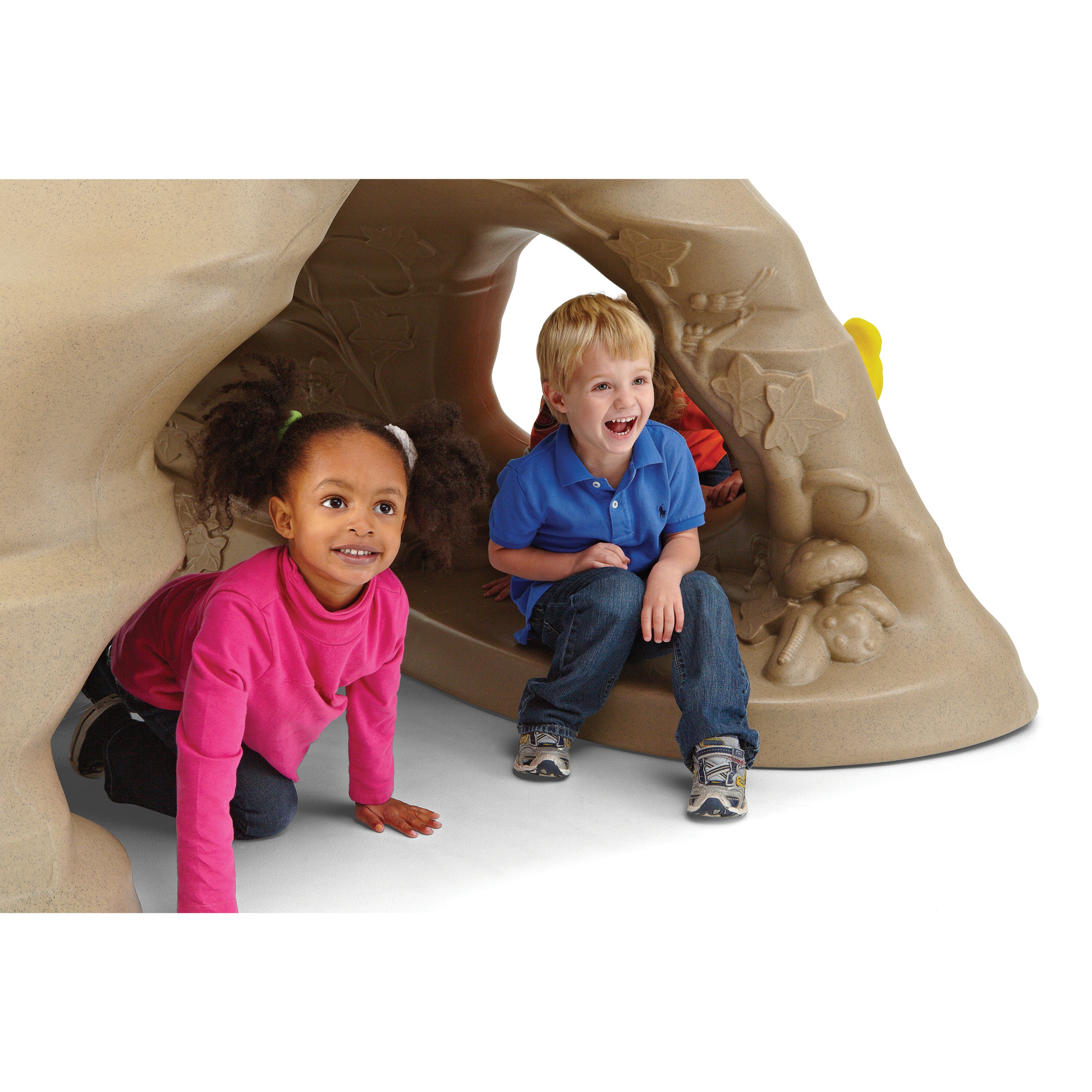 Two children playing inside a plastic cave on a white background