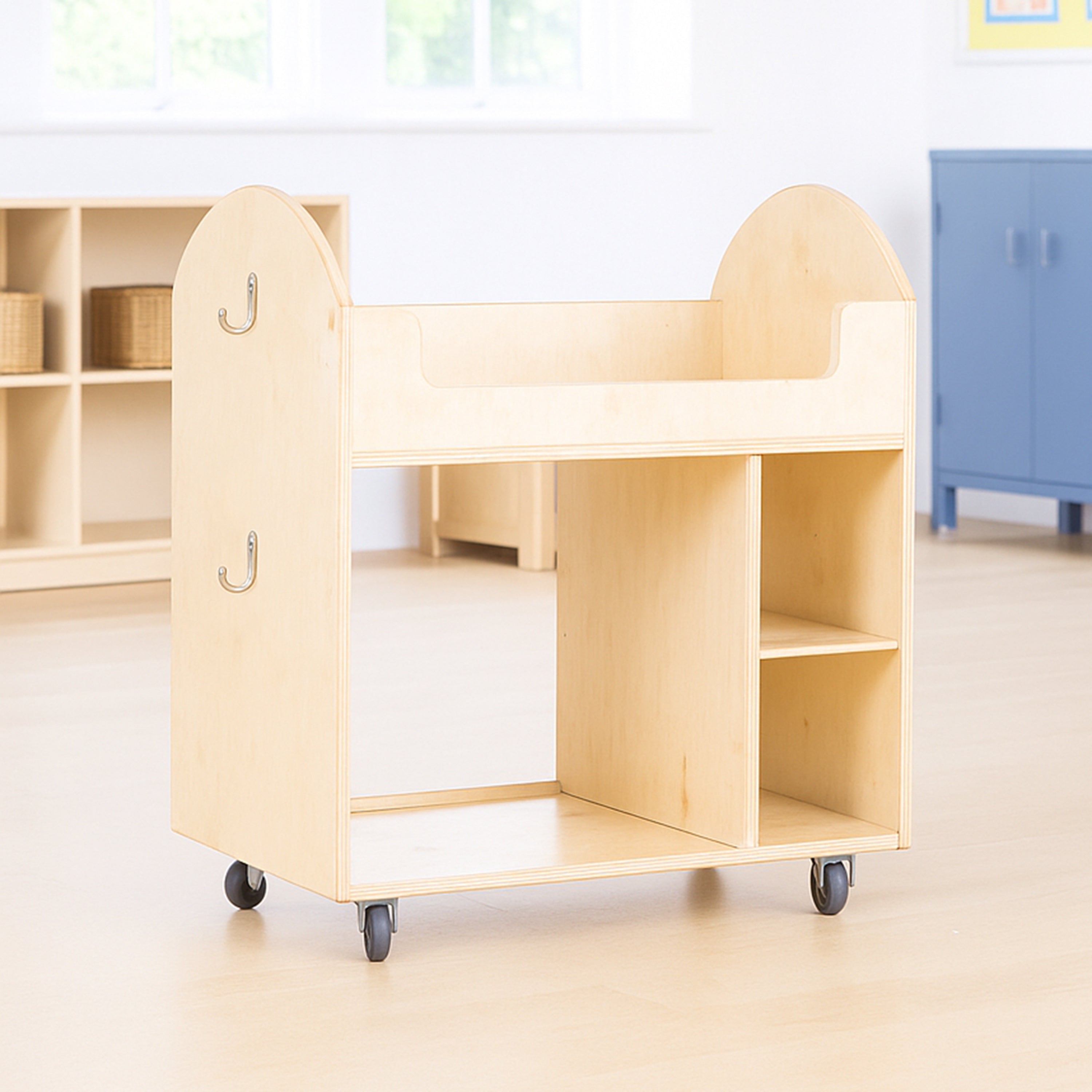 Wooden toy shelf with wheels in a classroom setting