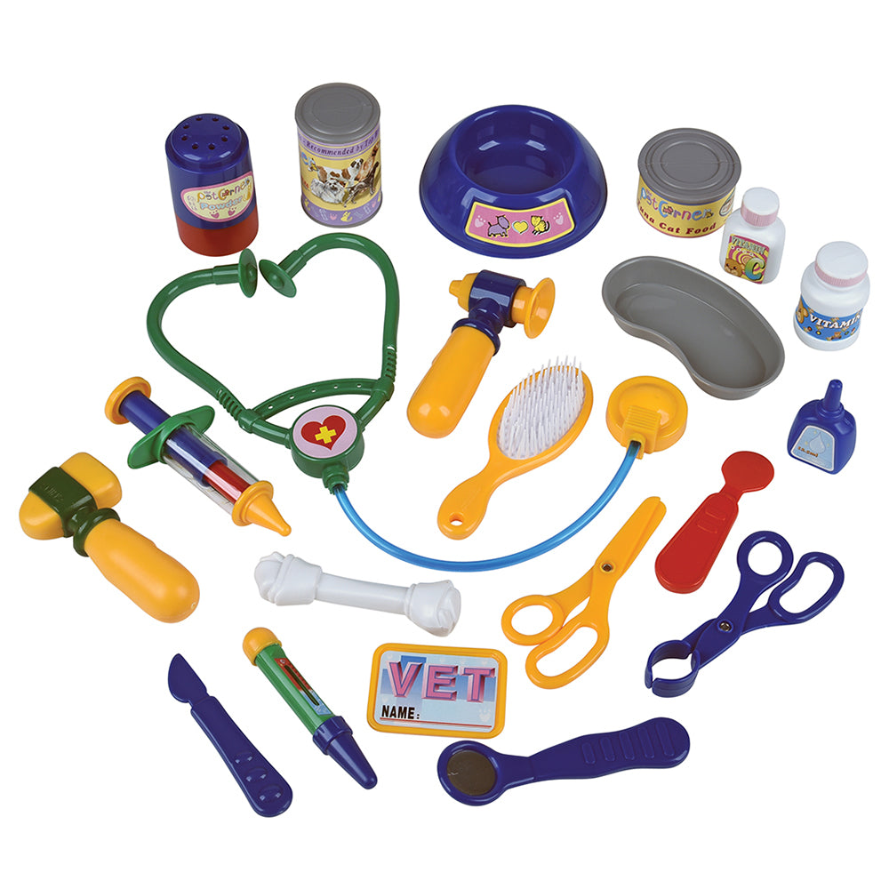 Collection of colorful toy veterinary tools on a white background