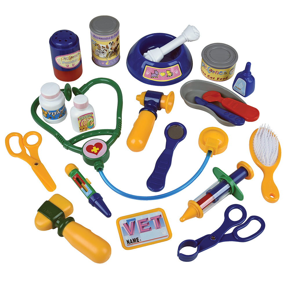 Colorful toy vet clinic set with various tools on a white background