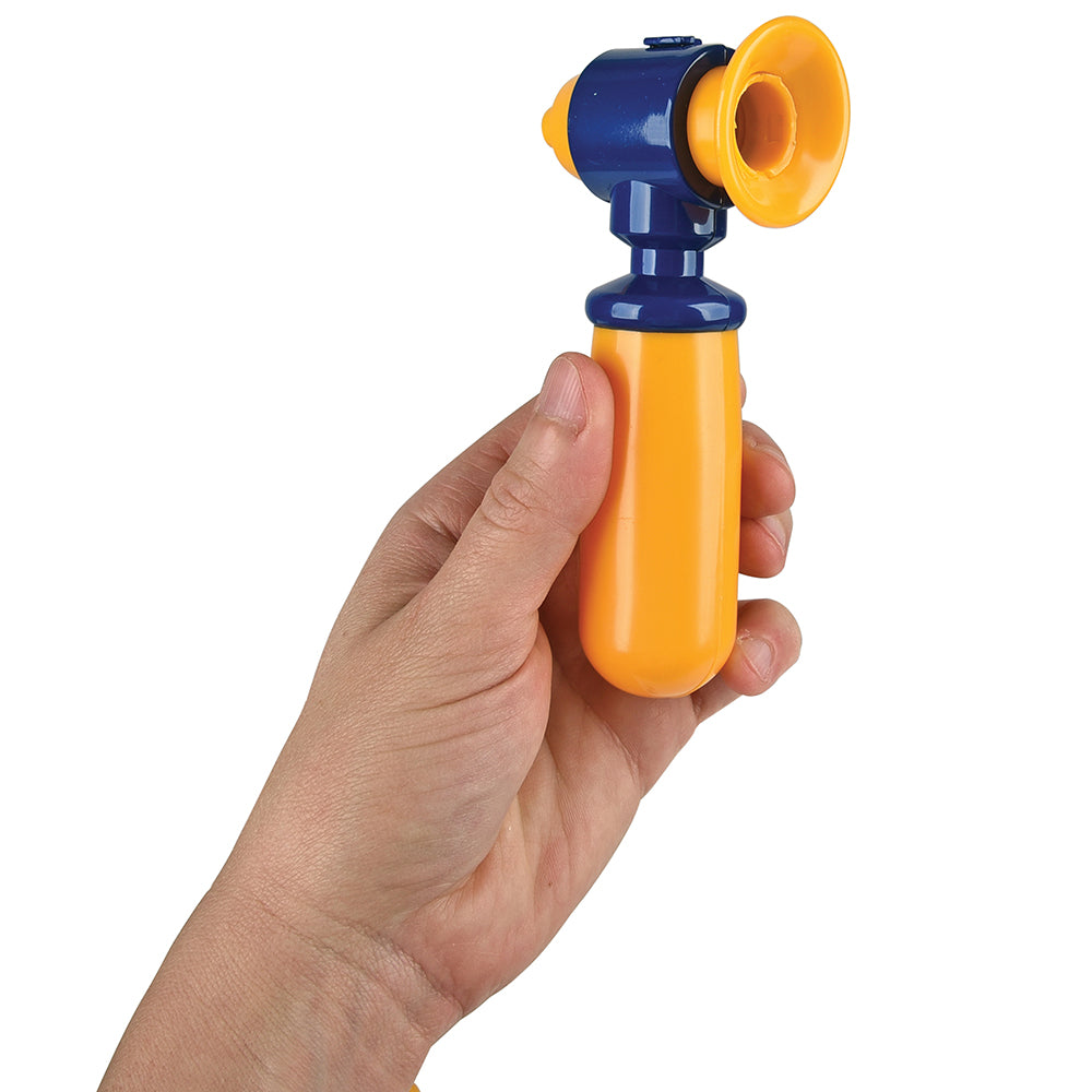 Hand holding a colorful toy ear scope with an orange handle and blue top on a white background