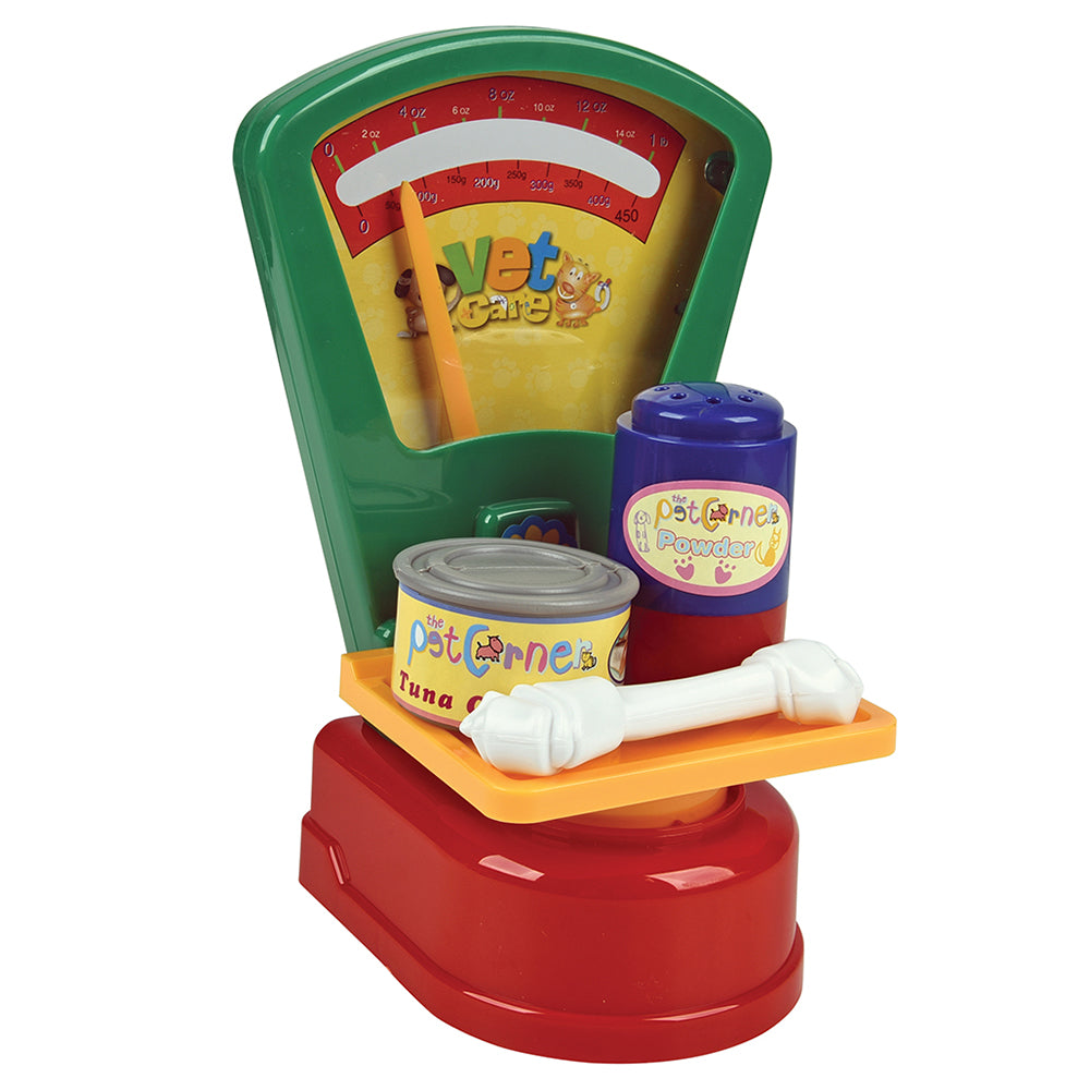 Toy pet scale with accessories on a white background